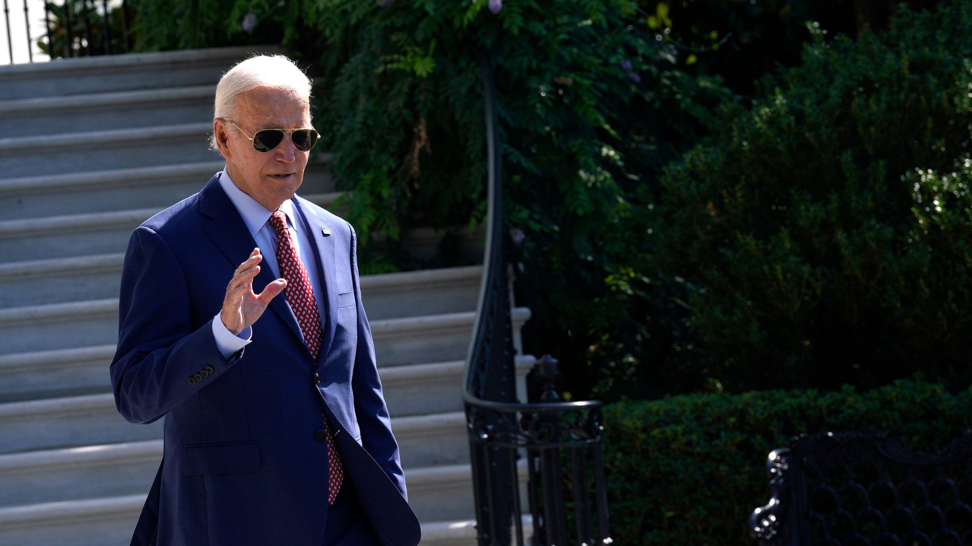 Biden walks to board Marine One