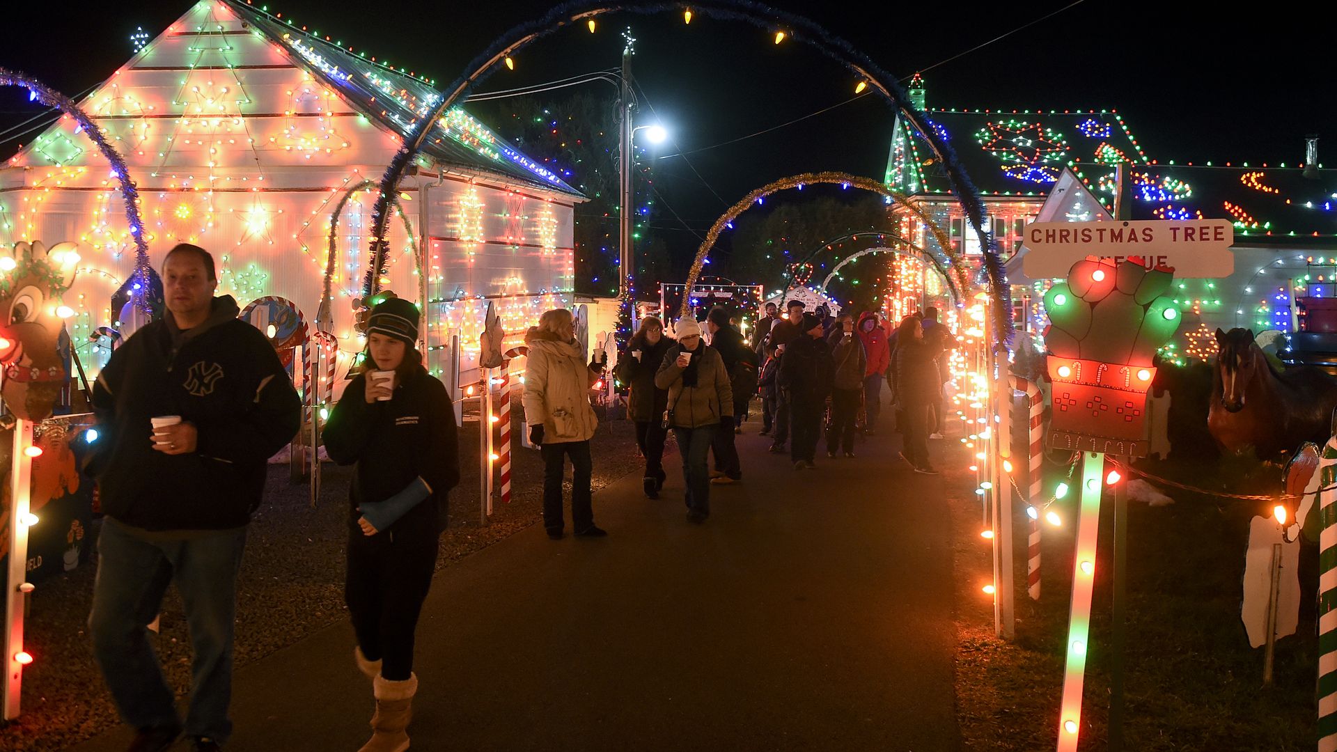 Visitors stroll through a lights display at Koziar's Christmas Village in Bernville. 