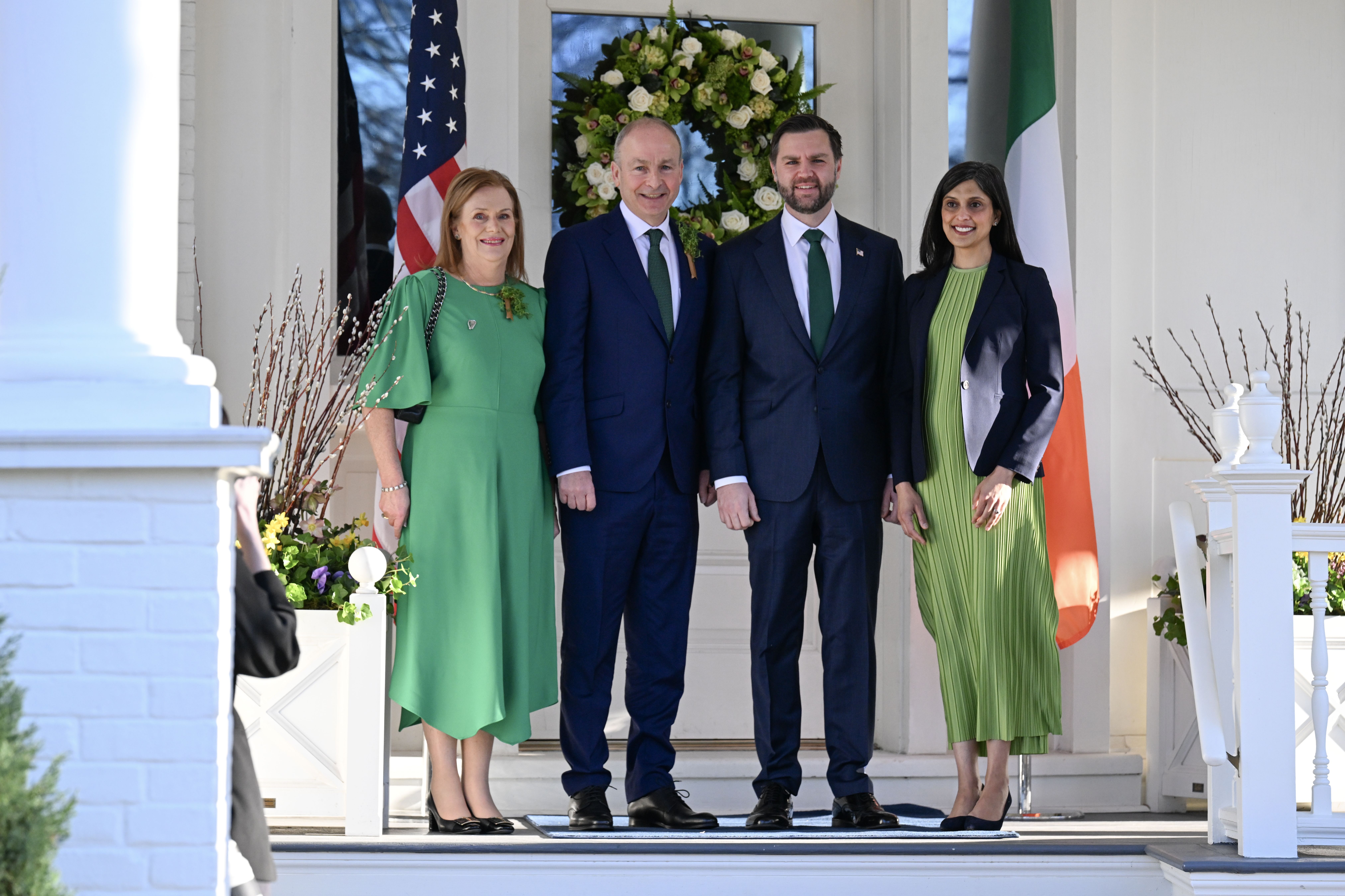 US Vice President JD Vance and second lady Usha Vance greet the Taoiseach of Ireland Micheál Martin and his wife Mary O'Shea before a breakfast at the Vice President's residence in the US Naval Observatory on March 17, 2026 in Washington, DC. 