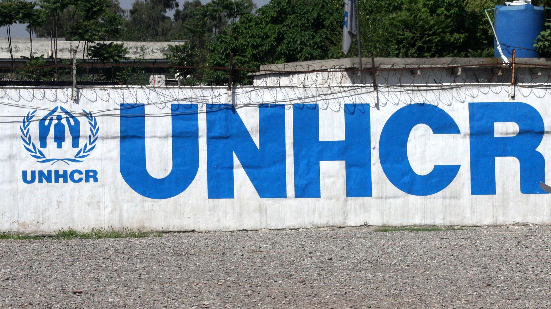 A UNHCR sign near the Afghanistan-Pakistan border. Photo: Saeed Ahmad /Anadolu Agency/Getty Images
