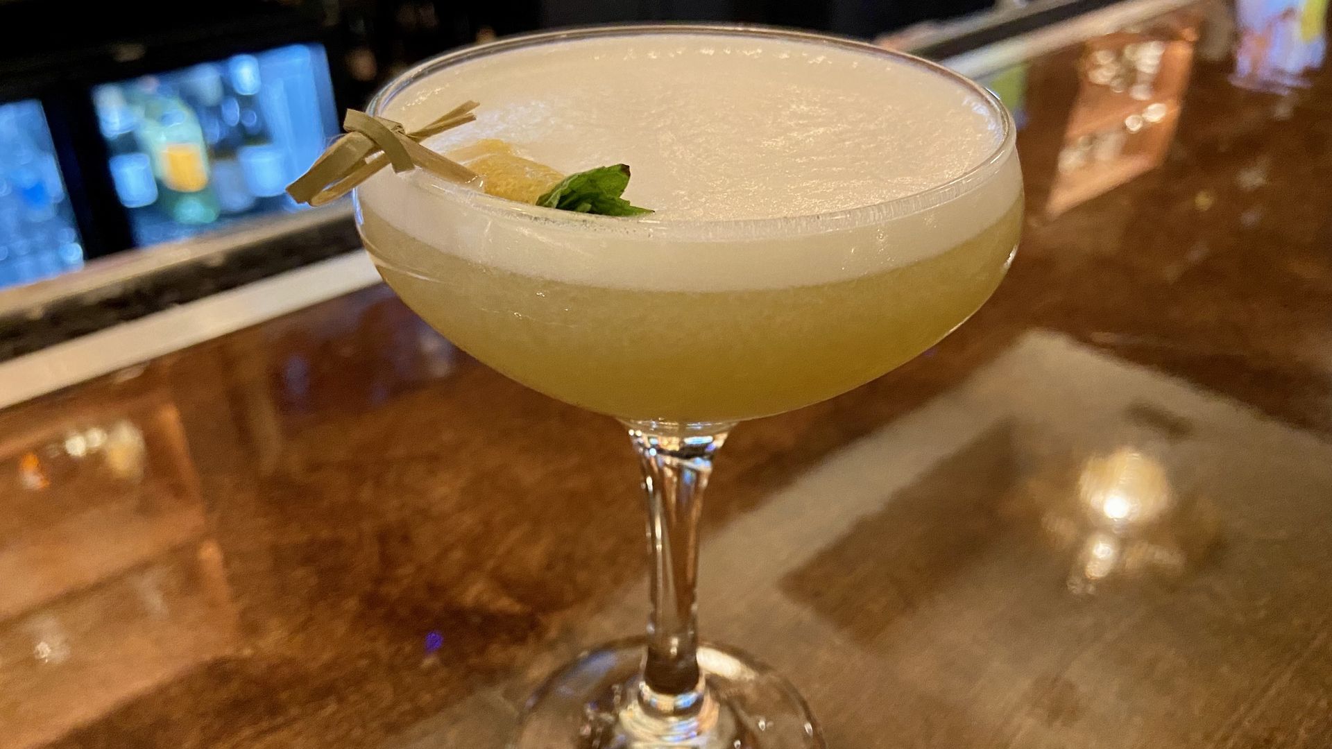 A photo of a yellow cocktail 