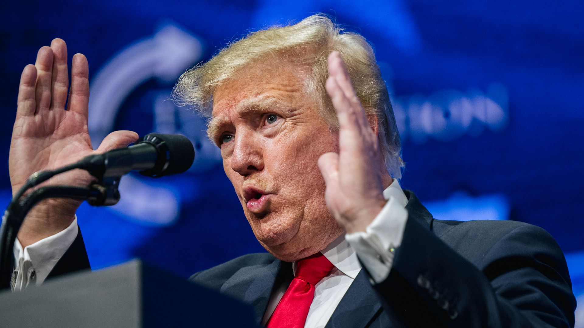 Picture of Donald Trump speaking behind a podium