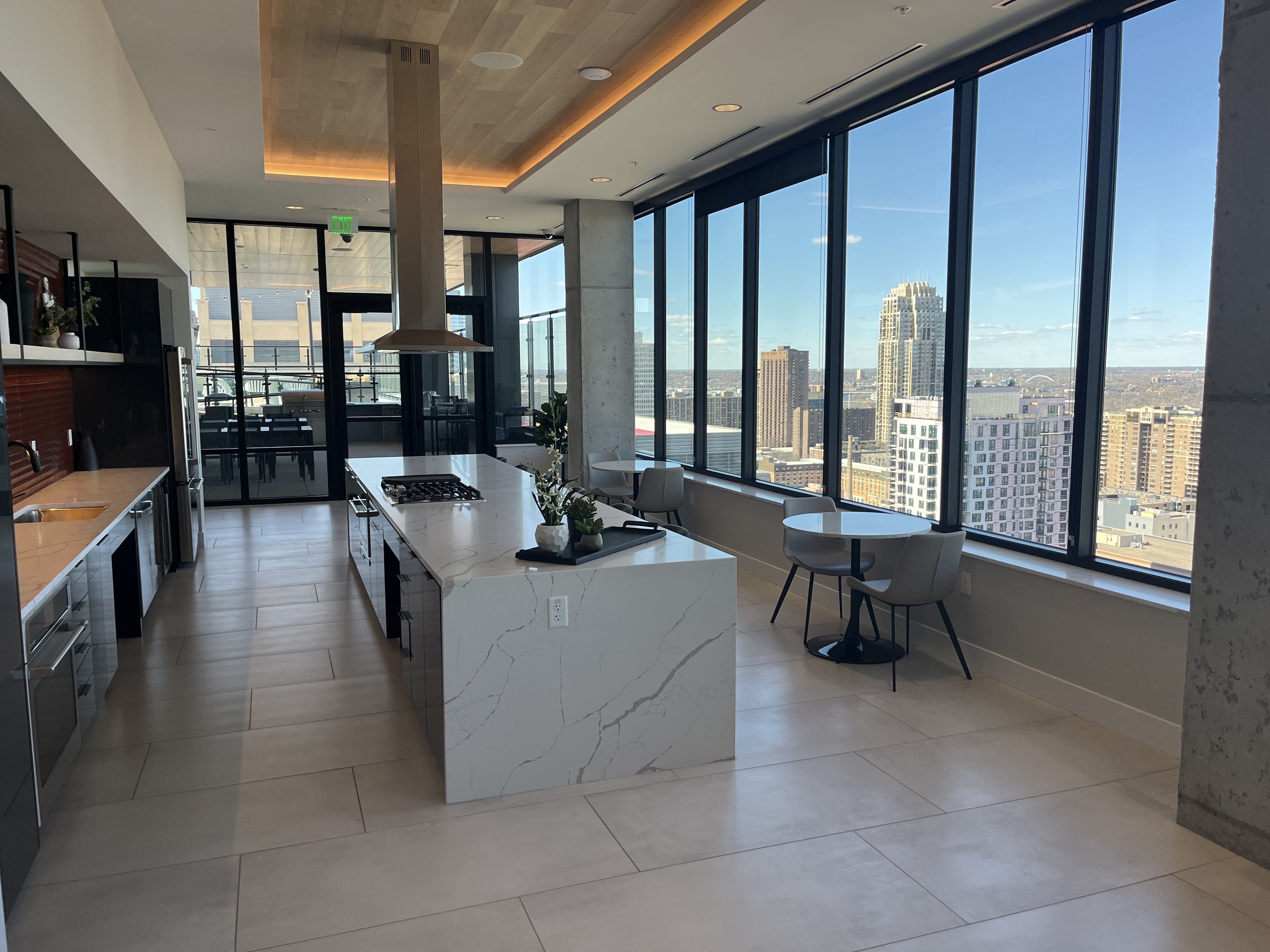 A kitchen area with windows looking out on the Mill District 