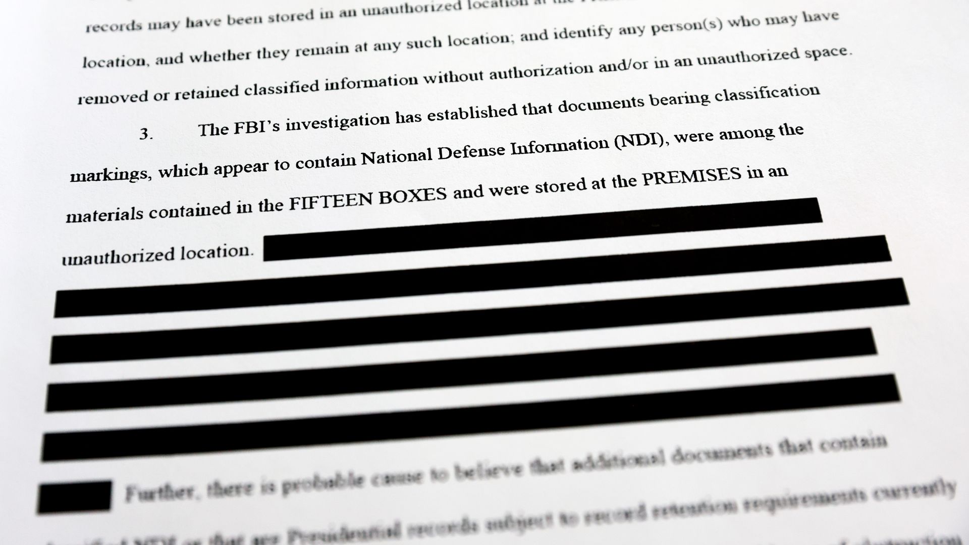 A page is viewed from the government’s released version of the F.B.I. search warrant affidavit for former President Donald Trump's Mar-a-Lago estate on August 27, 2022 in California