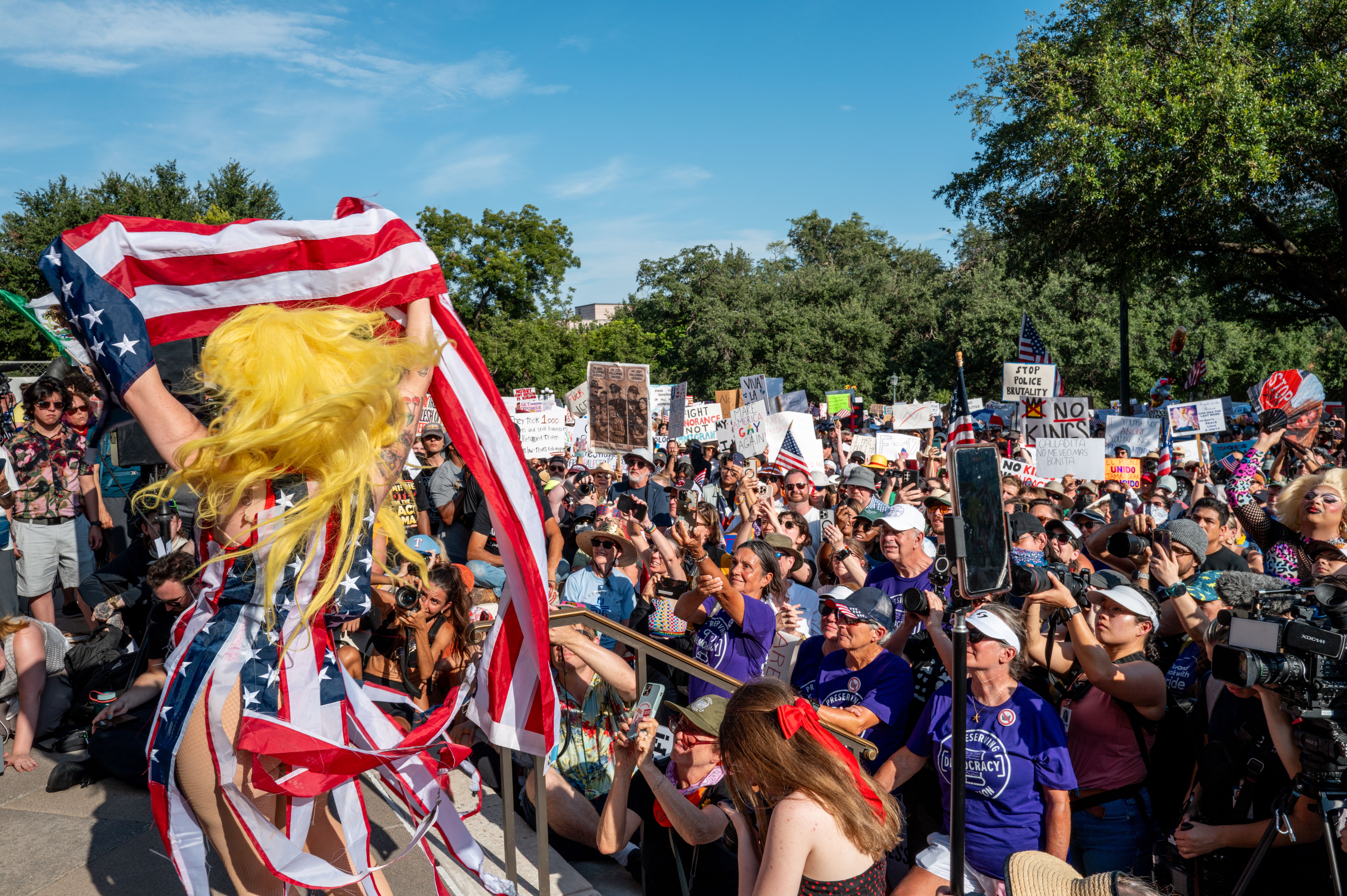  Drag Queen Brigitte Bandit performs during the "No Kings Day" demonstration at the Texas State Capitol on June 14, 2025 in Austin, Texas. Marches and protests against the Trump administration and its policies are happening across the United States today. 