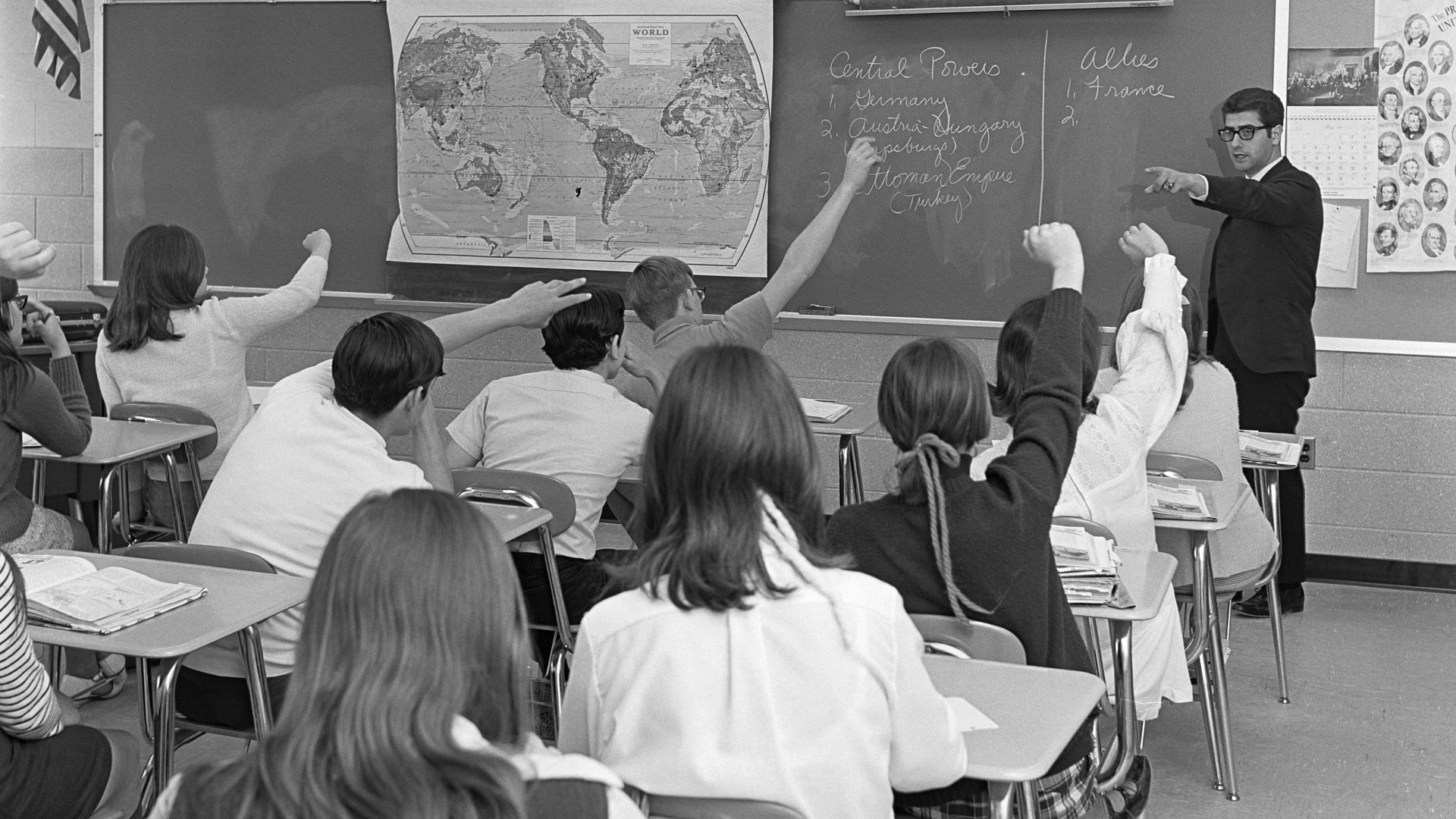 Photo of teacher and students in a classroom 