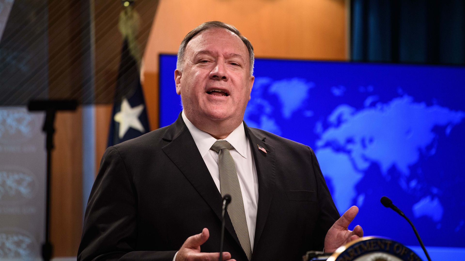 Secretary of State Mike Pompeo speaking in a press room