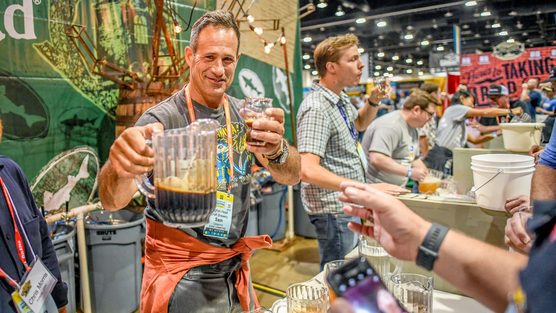 Dogfish Head's Sam Calagione pours beer at the 2019 GABF. Photo courtesy of Brewers Association