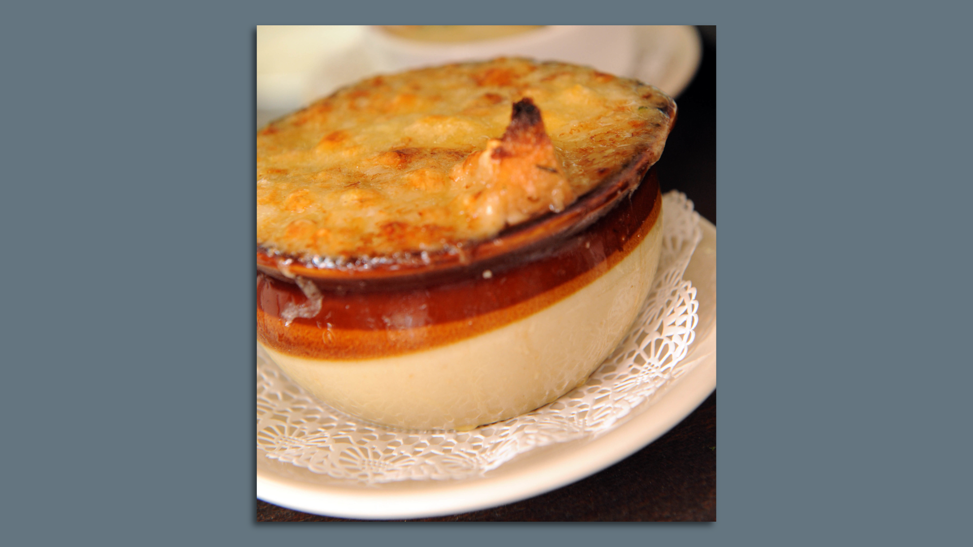 Photo shows a bowl of French onion soup