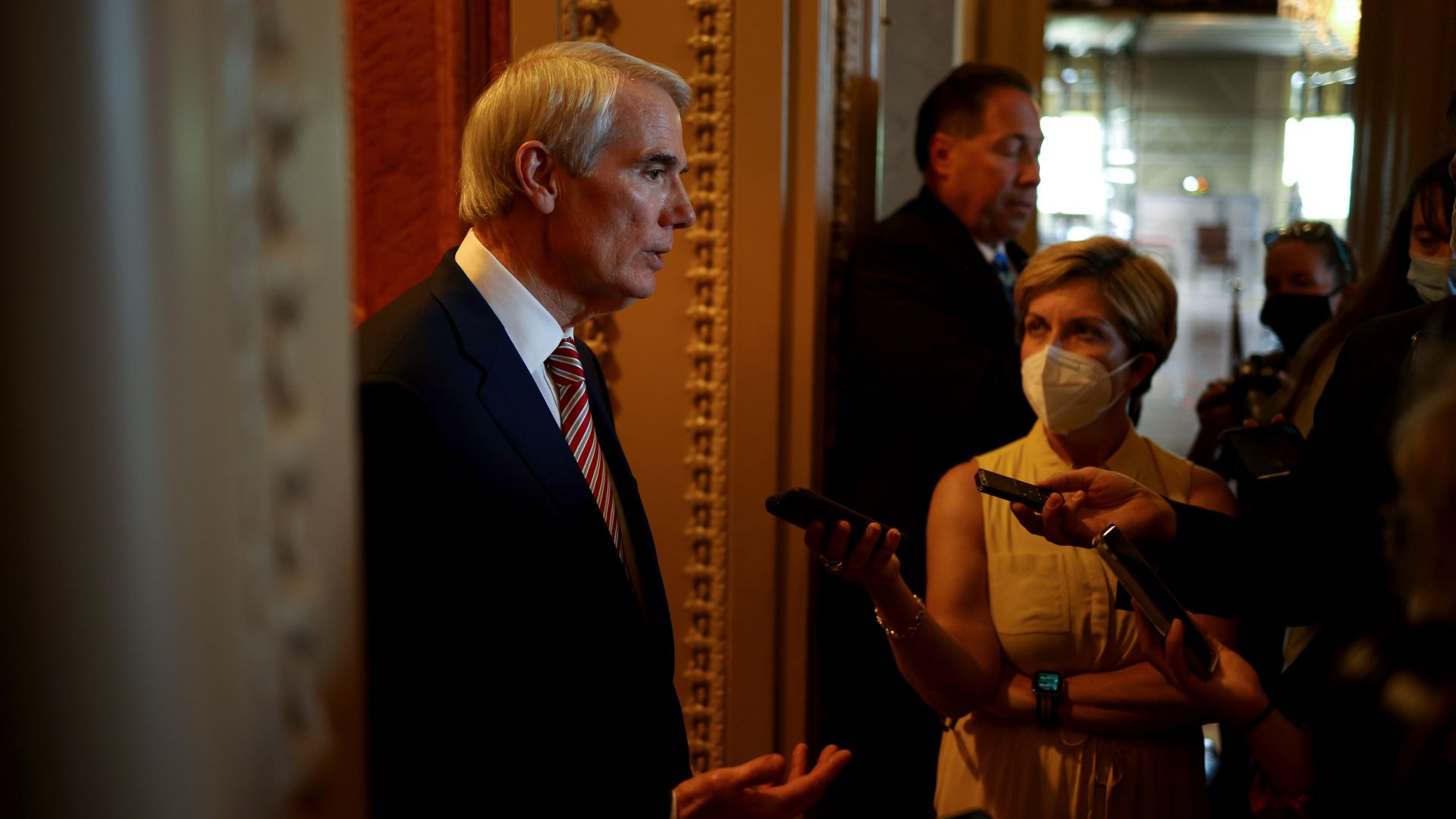 Sen. Rob Portman is seen speaking with reporters amid the Senate's infrastructure debate.