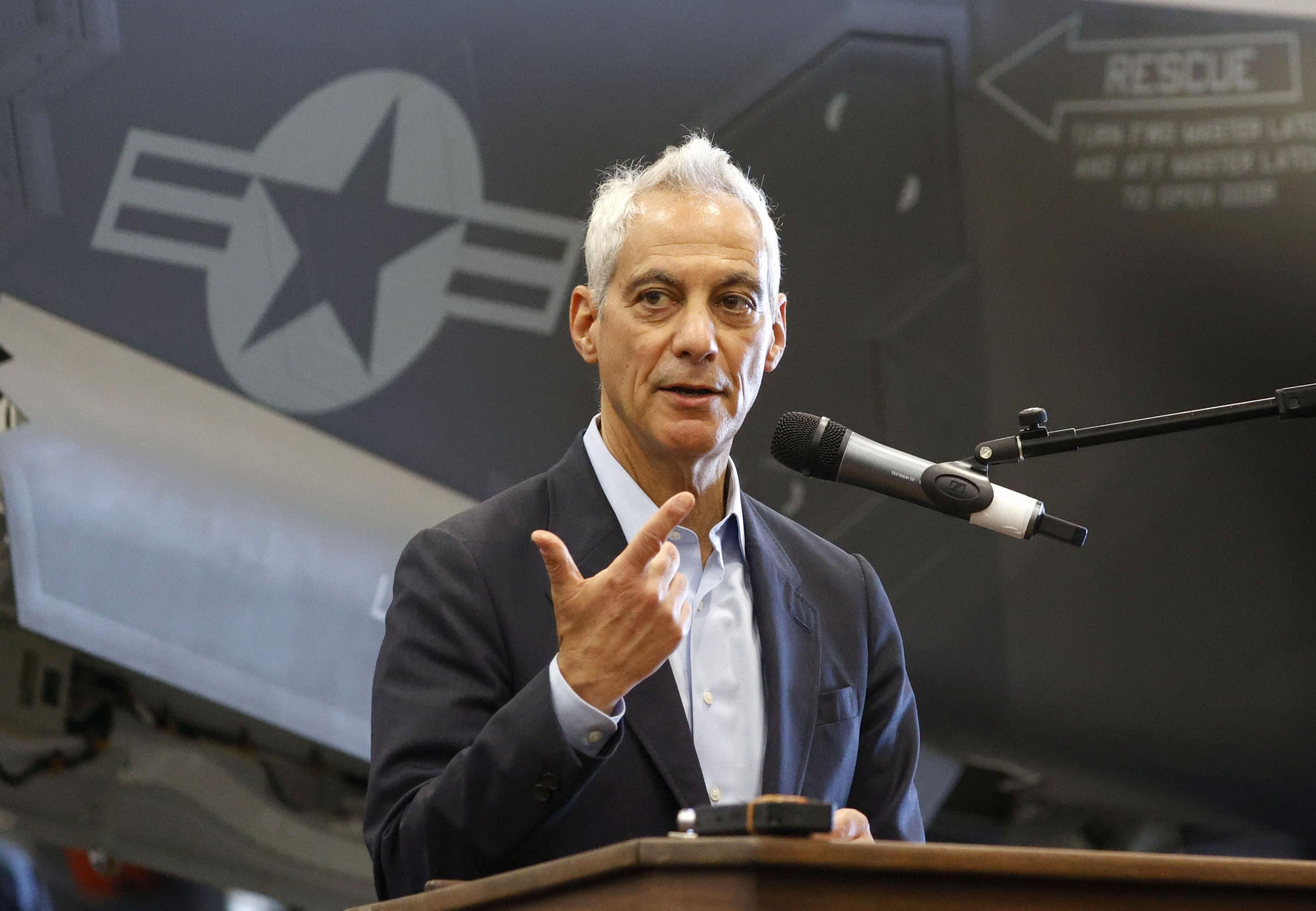 Ambassador to Japan Rahm Emanuel speaks at a press conference on the USS George Washington aircraft carrier in the South China Sea last month.