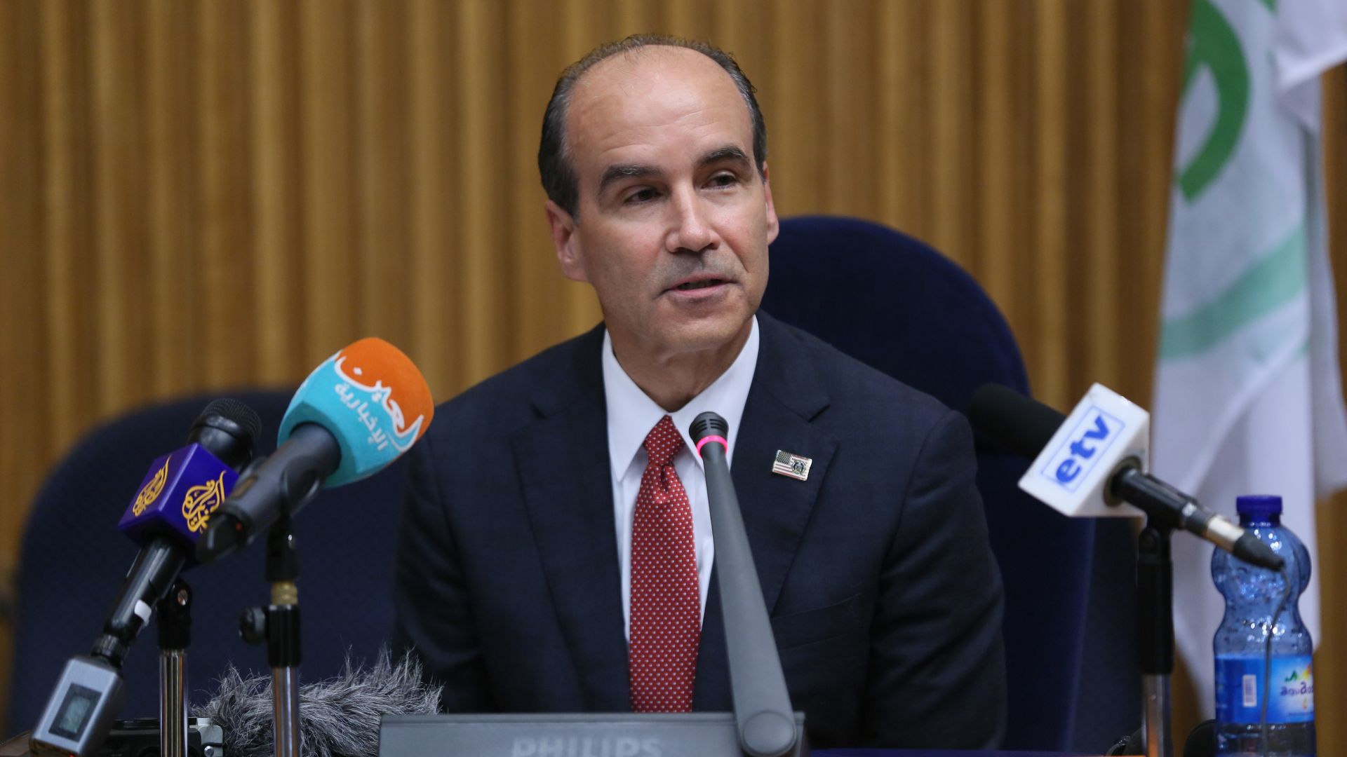 Mark Menezes speaks at a forum