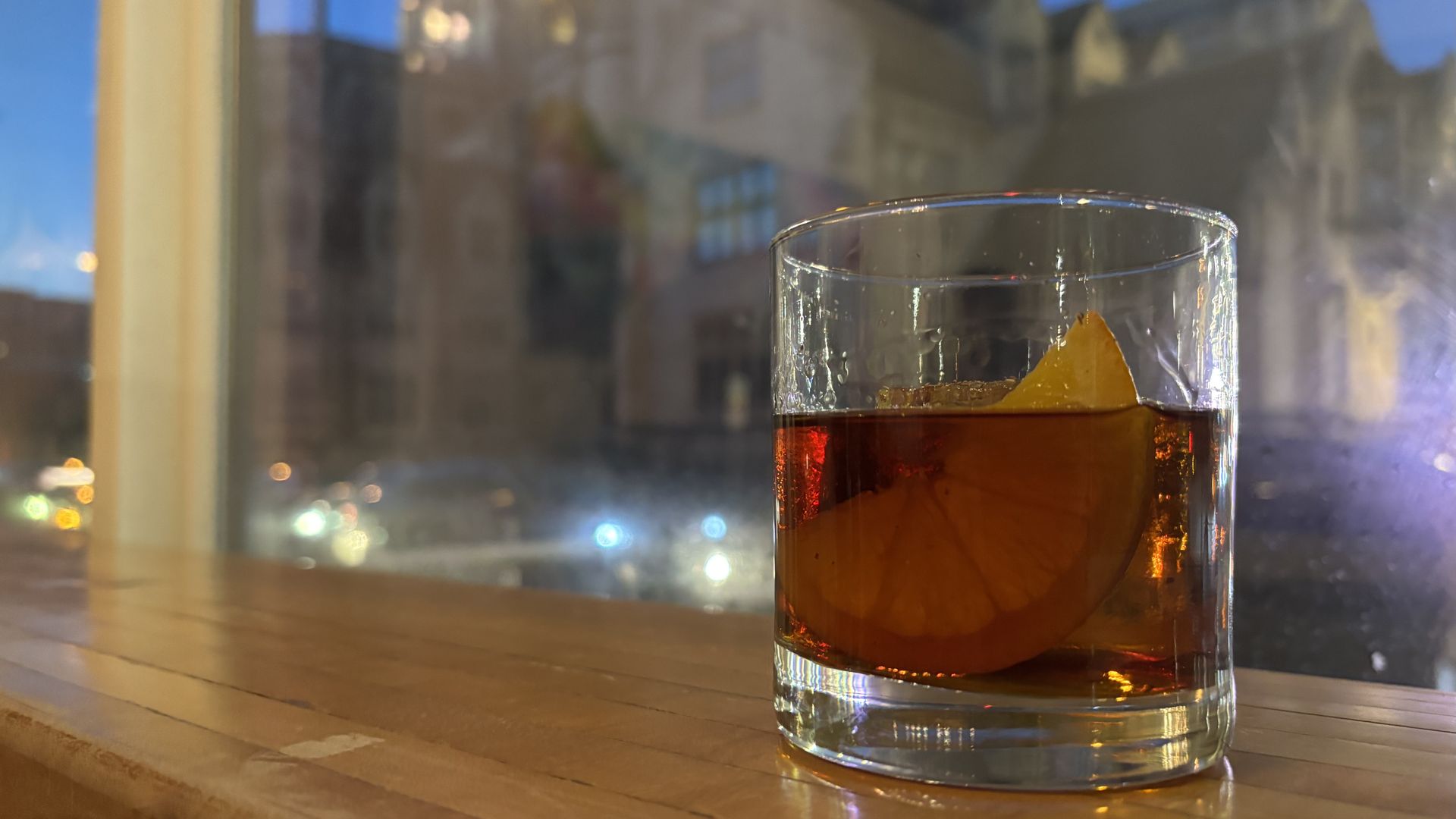 A tum tugger cocktail at a Lorelei in Pittsburgh's East Liberty neighborhood, with a view of the East Liberty Presbyterian Church