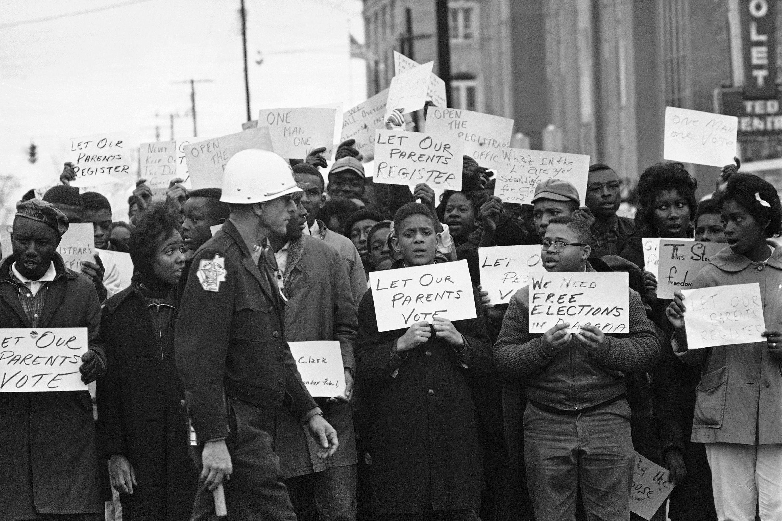 FILE - Young people sing and chant during a demonstration at the courthouse in Selma, Ala., Feb. 5, 1965, protesting voter registration. (AP Photo/Bill Hudson, File)
