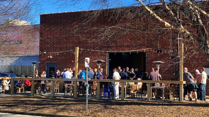 wooden-robot-patio-crowd