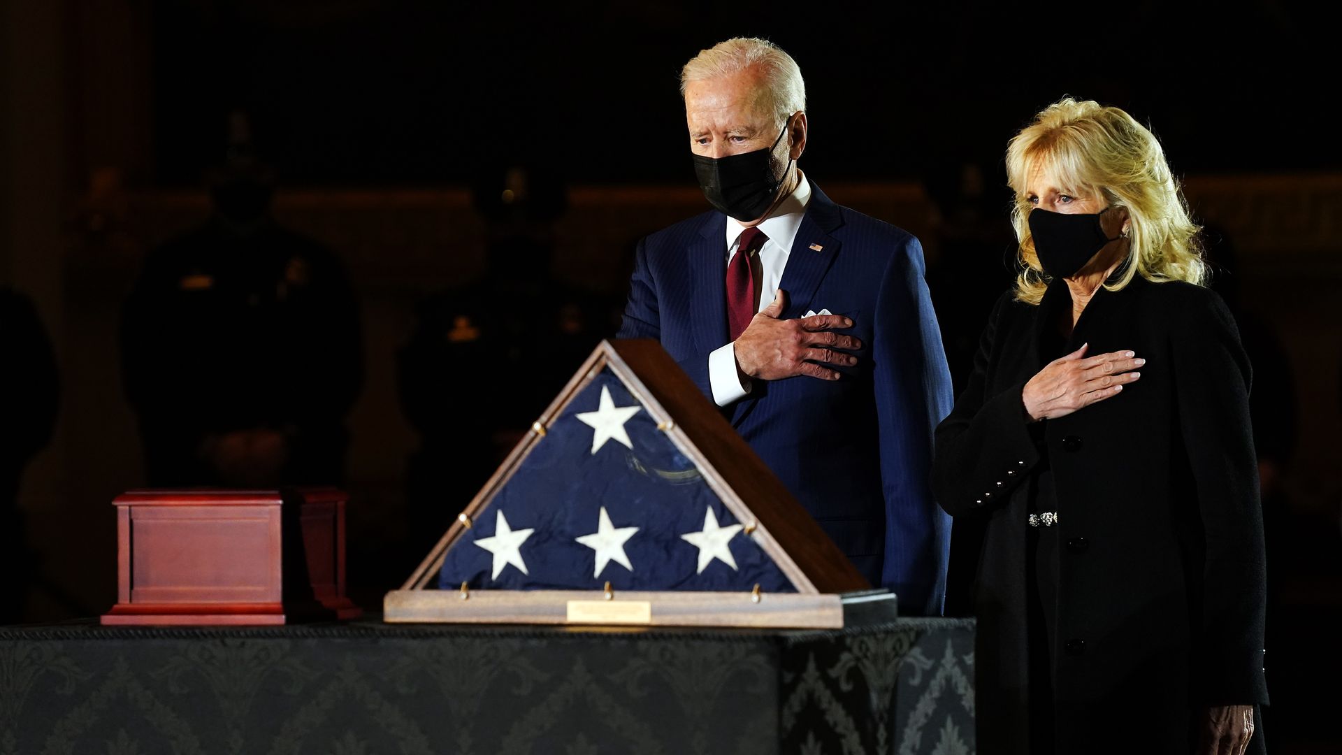 Joe Biden and First Lady Jill Biden pay their respects in front of the remains of U.S. Capitol Police Officer Brian Sicknick in the Rotunda of the U.S. Capitol in Washington, D.C