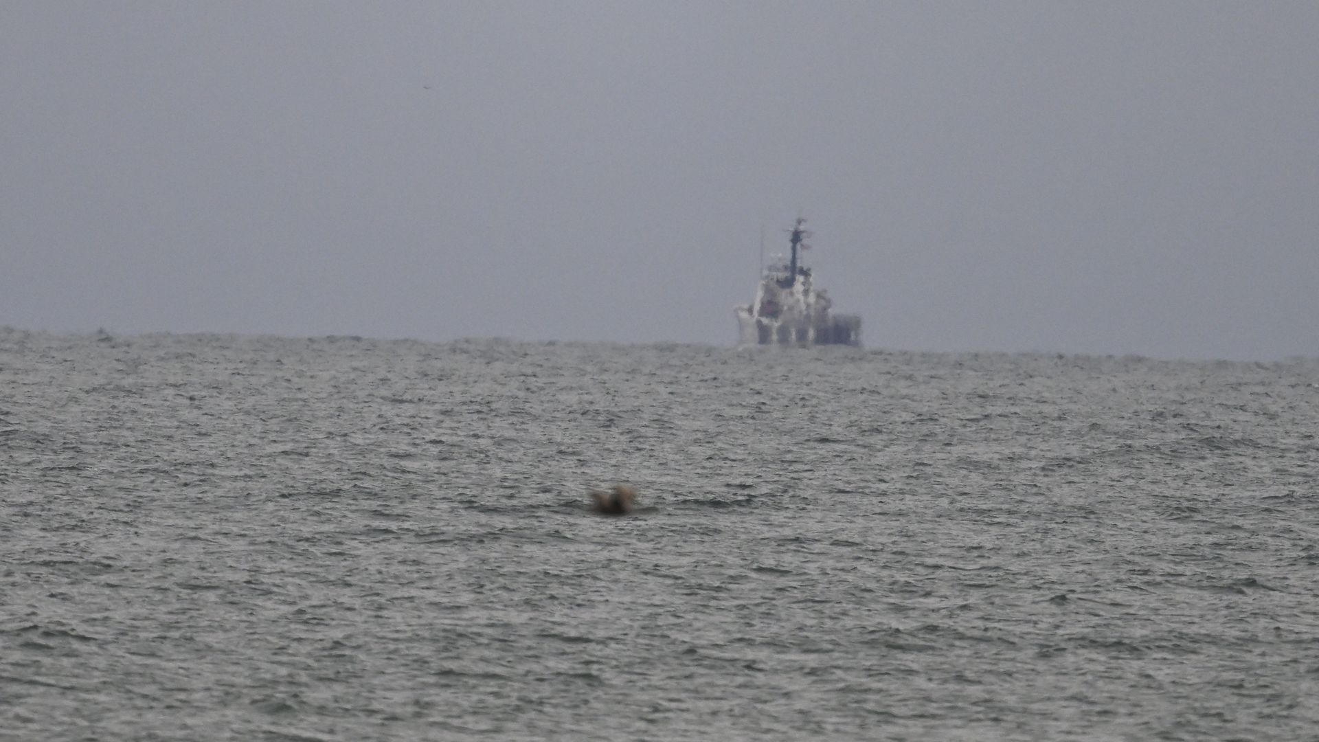 A ship scans the sea during efforts to retrieve and recover the Chinese spy balloon on Sunday.