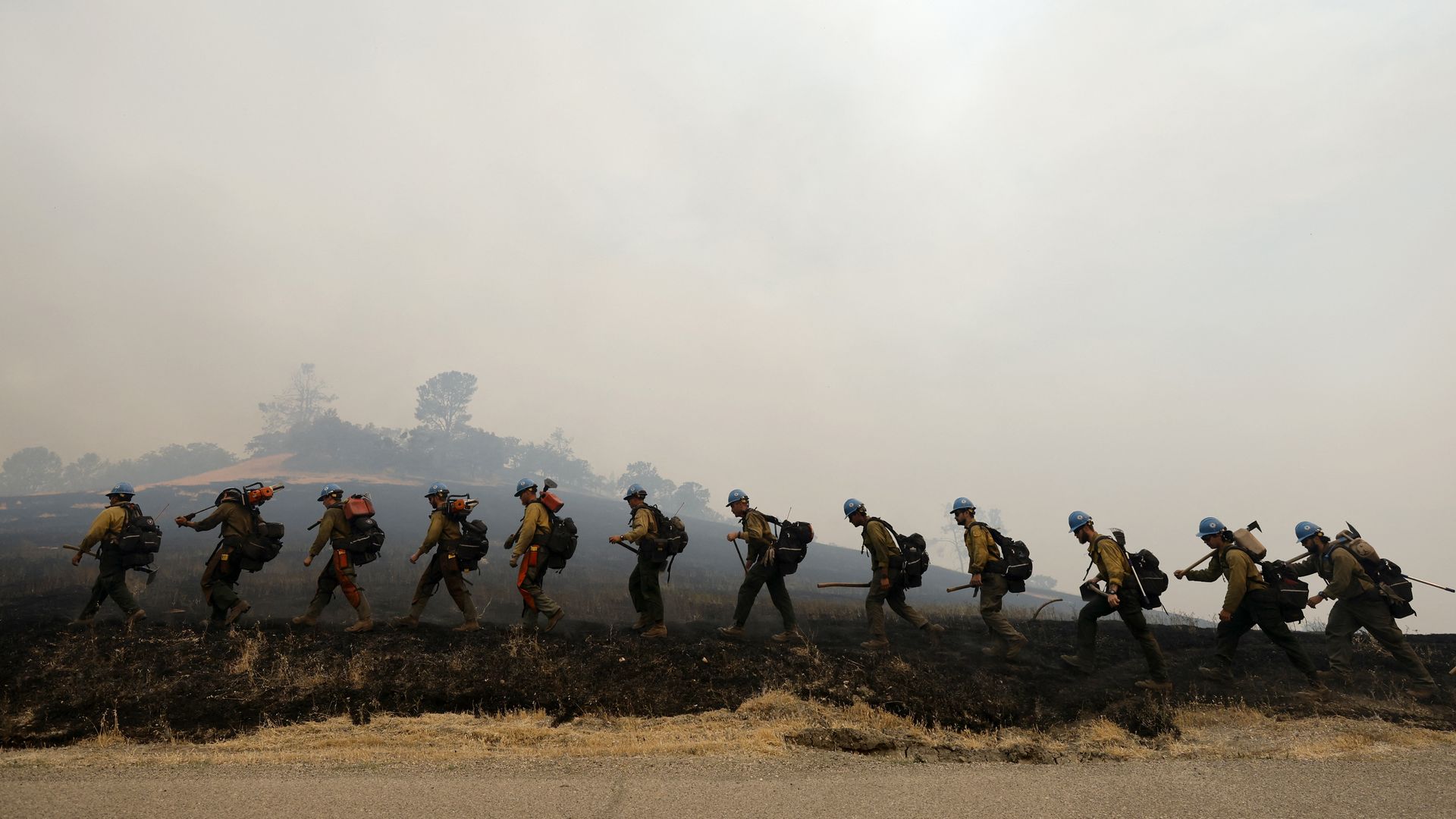 Members of the Arrowhead Hot Shot crew work to build a fire line as they continue to fight the Lake Fire, in Santa Barbara County, California on July 7, 2024.