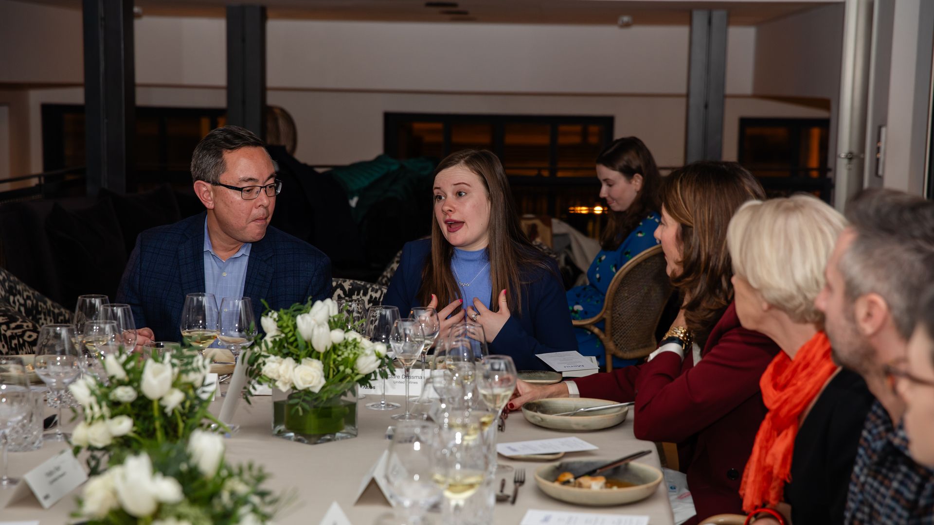 Attendees enjoying dinner during the conversation. Credit: Aleksandra Dynaś for Axios