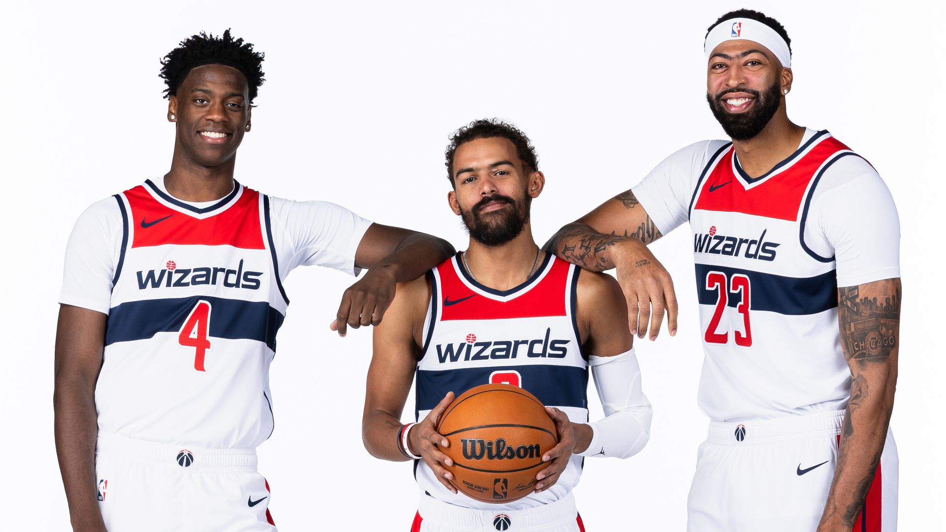 WASHINGTON, DC - SEPTEMBER 28: AJ Dybantsa #4, Trae Young #3, and Anthony Davis #23 of the Washington Wizards pose for a portrait during NBA media day on September 28, 2026 at Capital One Arena in Washington, DC.
