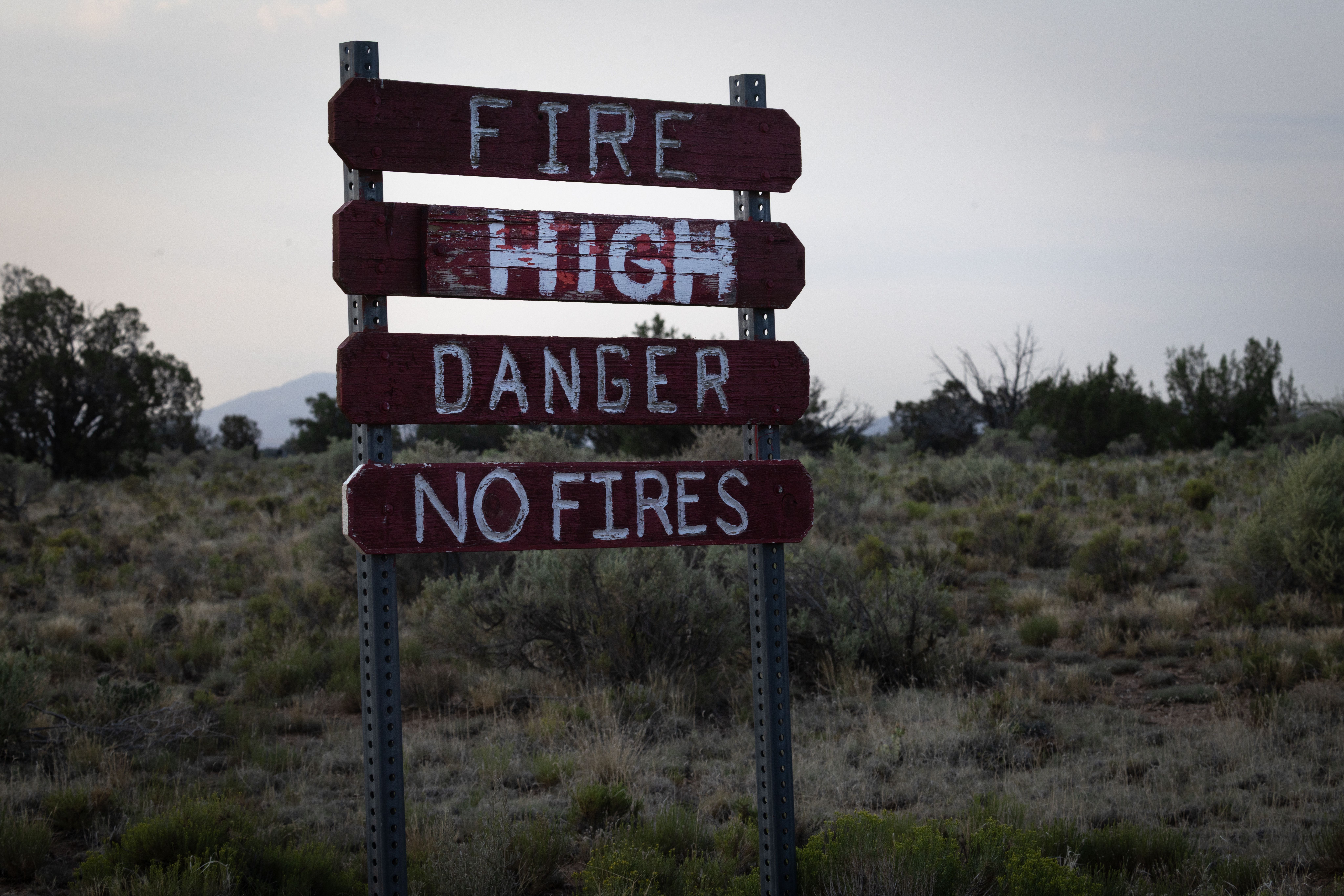 A sign near the Grand Canyon National Park warns of fire danger on July 15, 2025 near Grand Canyon, Arizona.