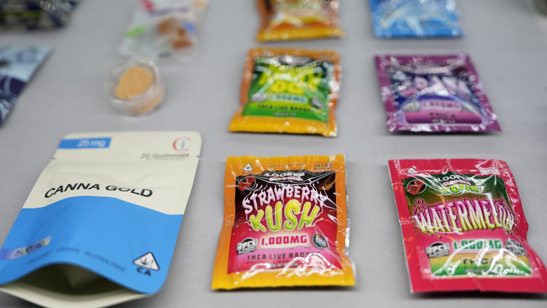 A photo of THC products lined up on a table.