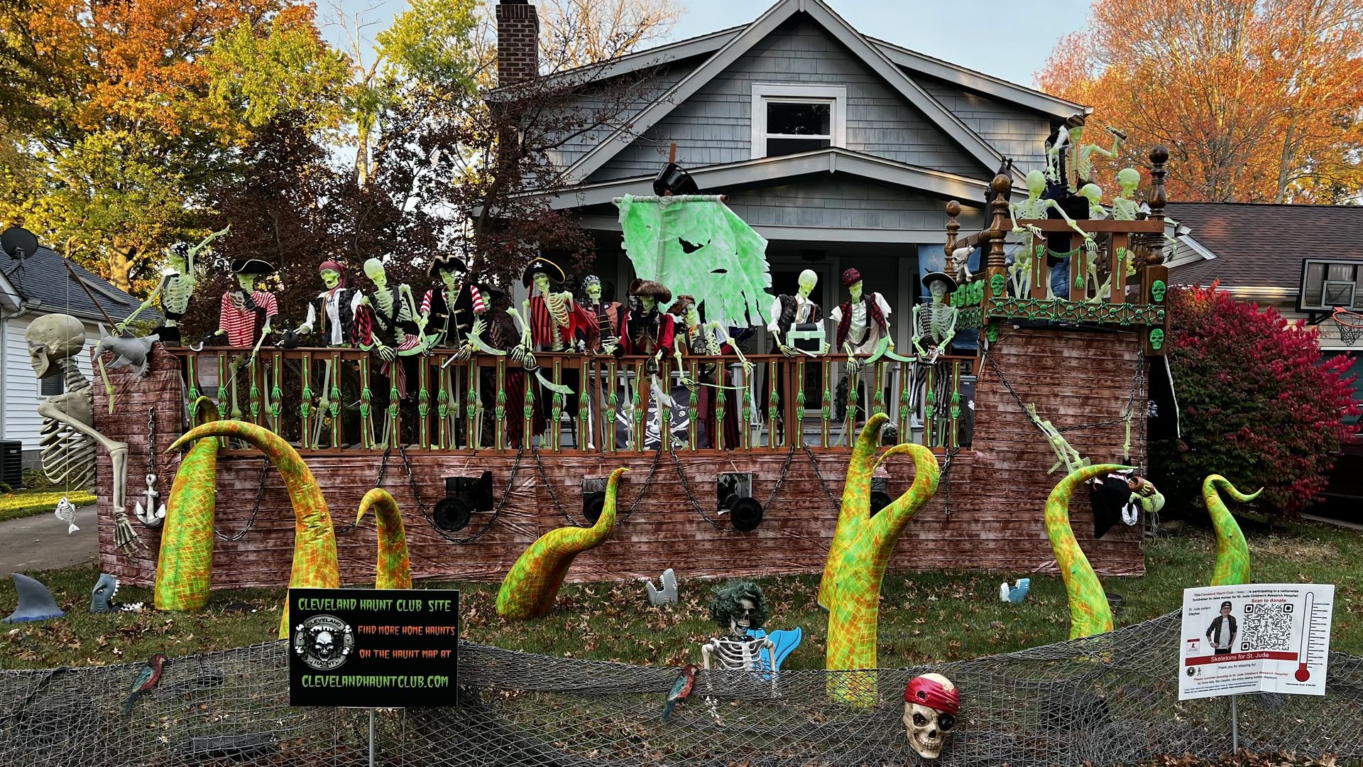 A home with a pirate ship and squid halloween decorations. 