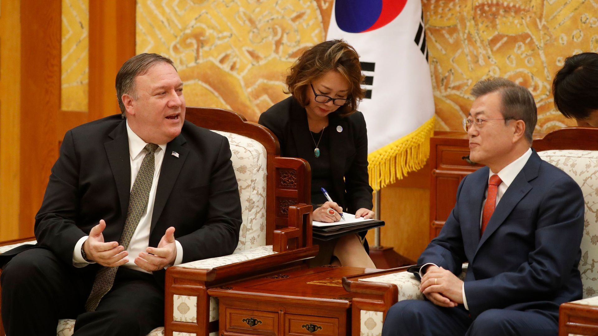 South Korean President Moon Jae-in (R) listens to US Secretary of State Mike Pompeo 