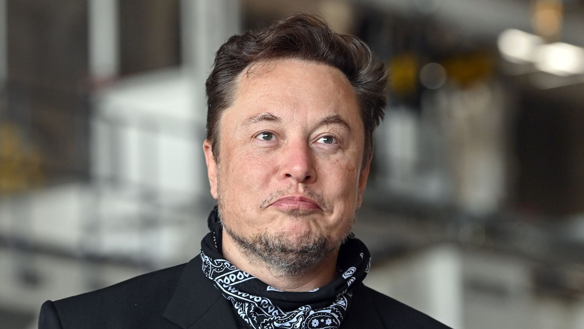 Elon Musk faces forward