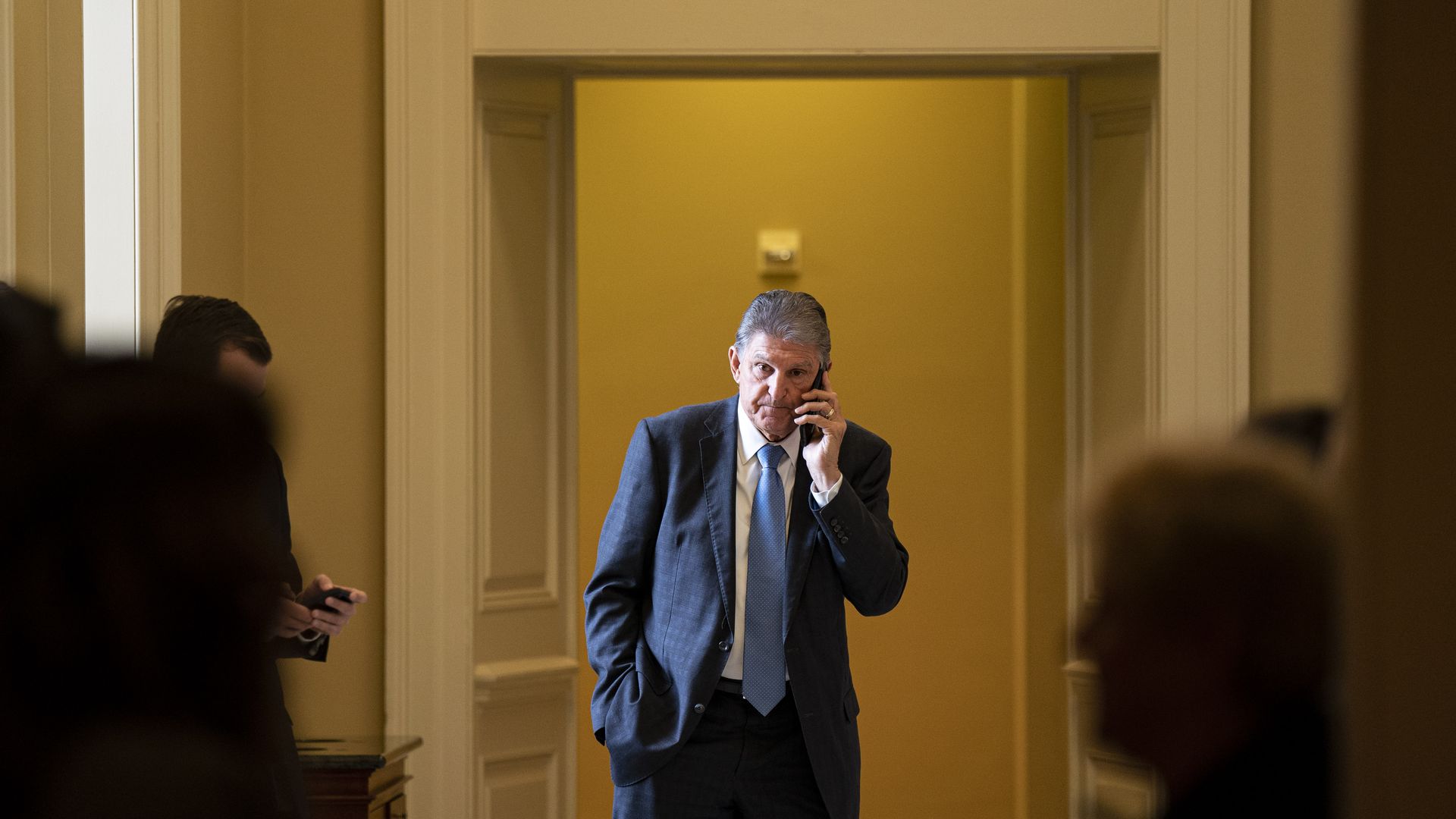 Senator Joe Manchin, a Democrat from West Virginia, speaks on the phone during the weekly Democratic caucus luncheon at the US Capitol in Washington, DC, US, on Tuesday, Nov. 29, 2022