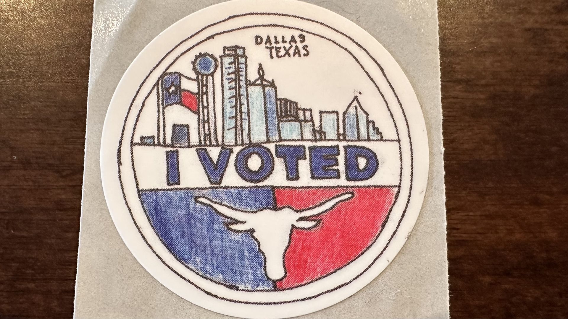 A photo of the Dallas County I voted sticker with the Dallas skyline