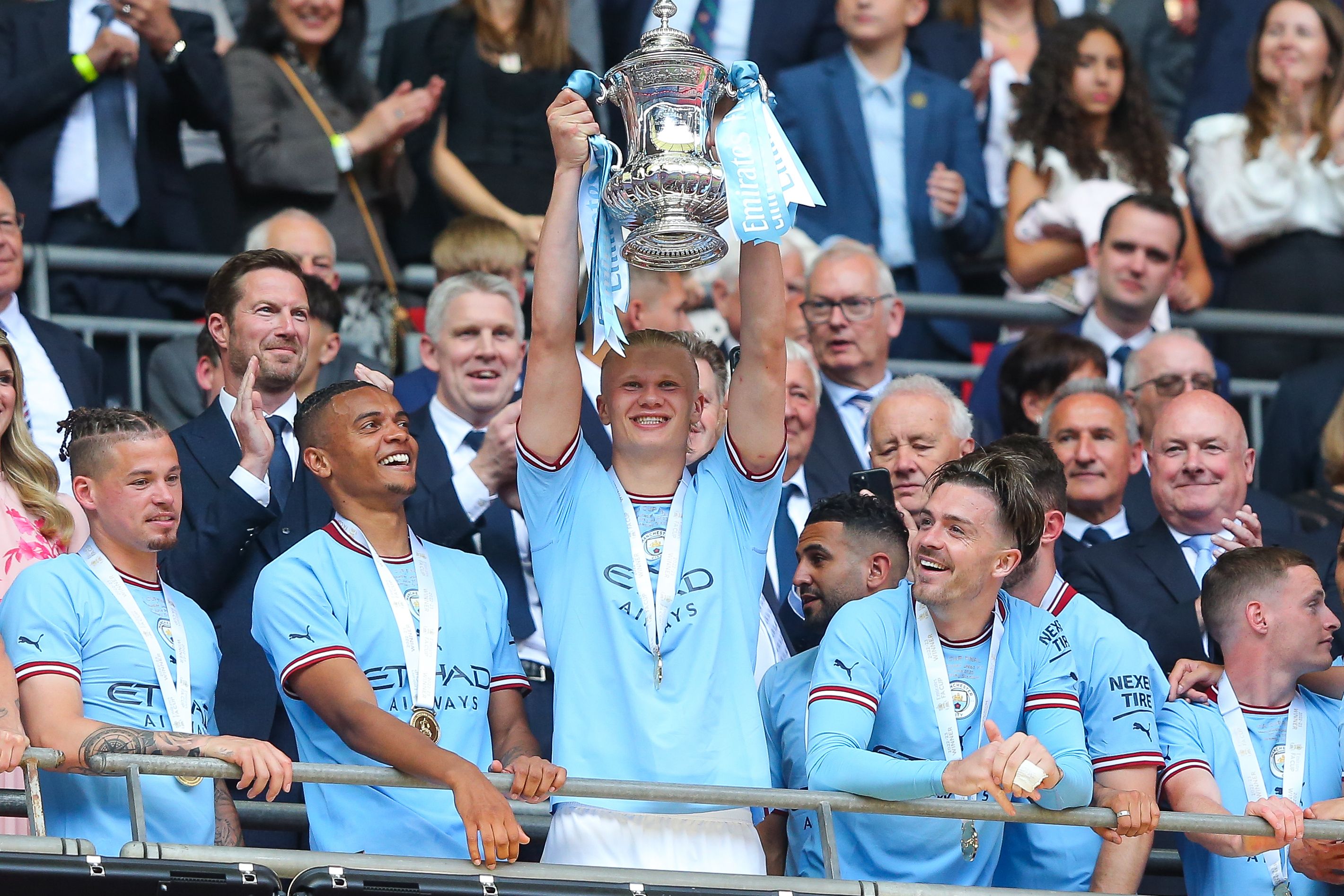 erling haaland holds trophy