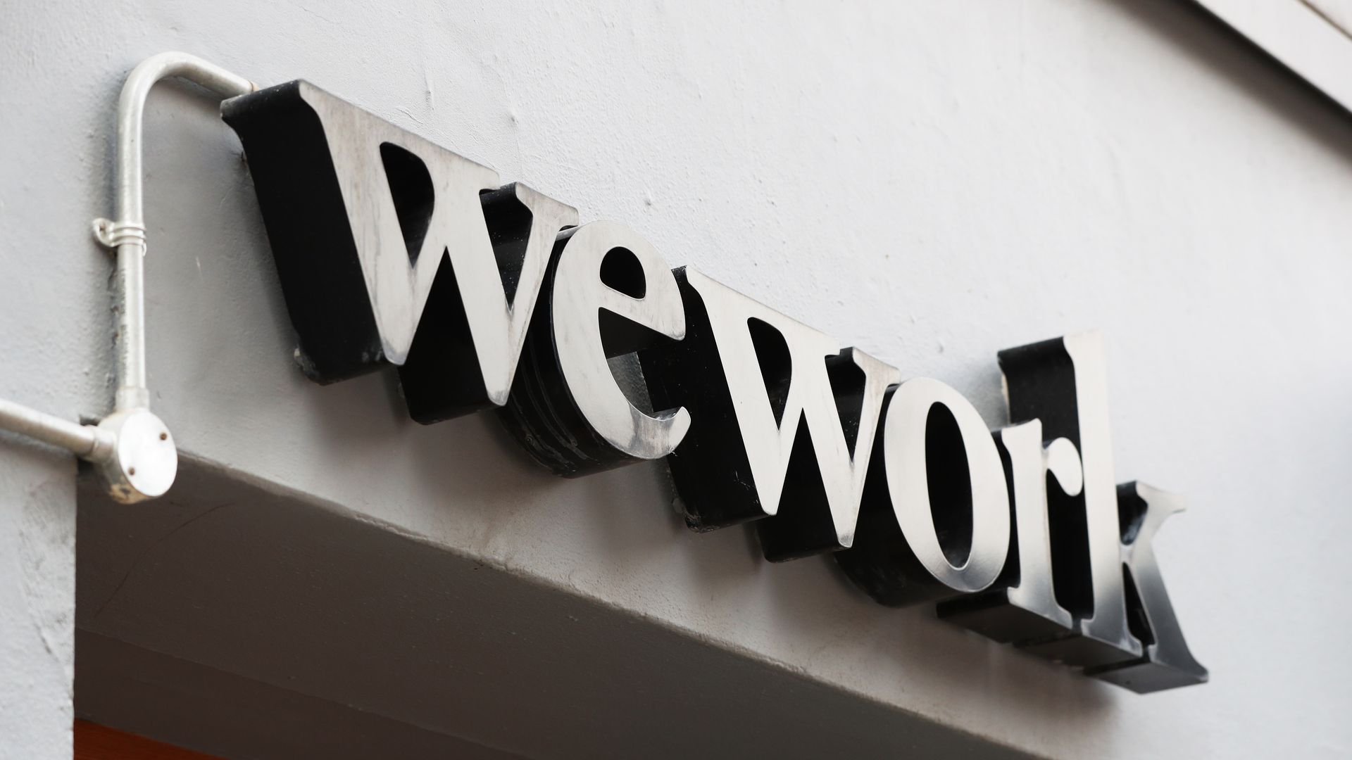 The WeWork sign outside of a community office