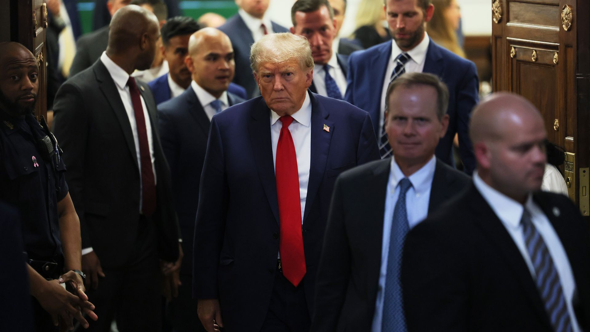 Former President Donald Trump leaves the courtroom after the second day of his civil fraud trial at New York State Supreme Court on October 03, 2023 in New York City.