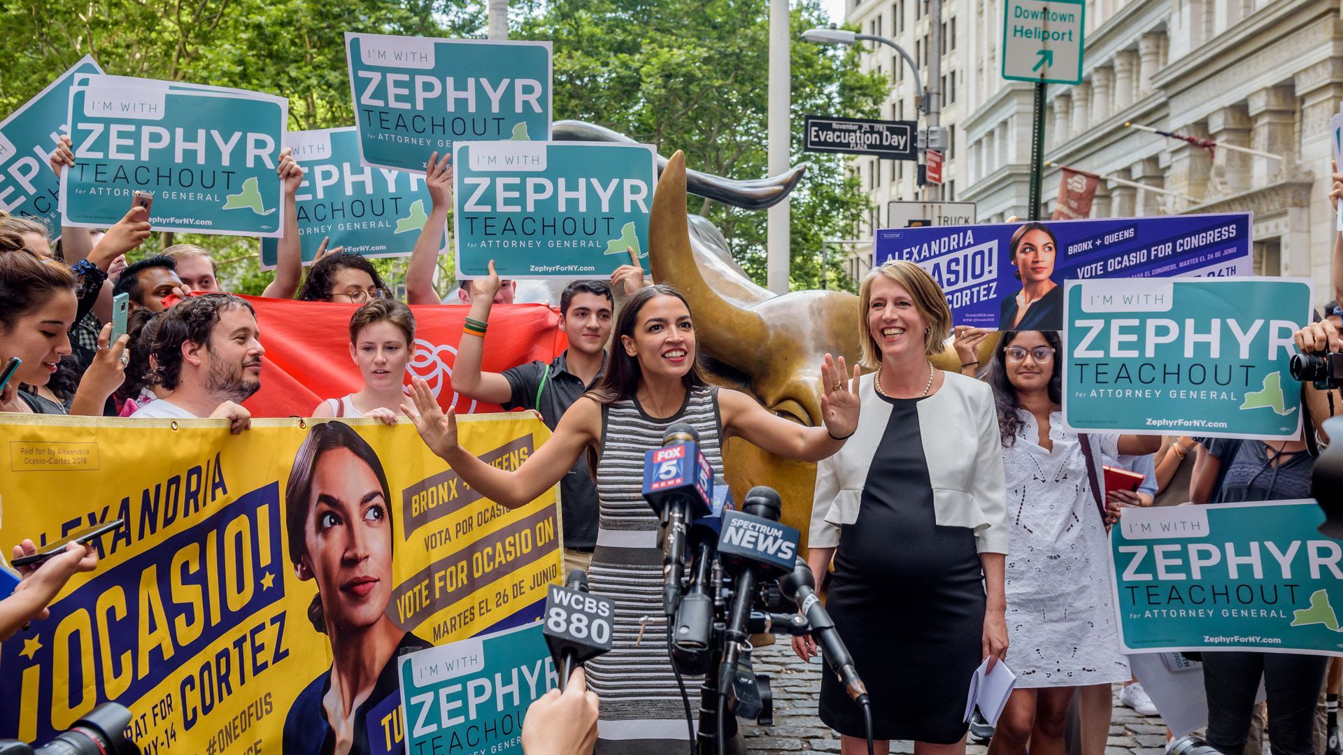 Alexandria Ocasio-Cortez speaking in front of a crowd.