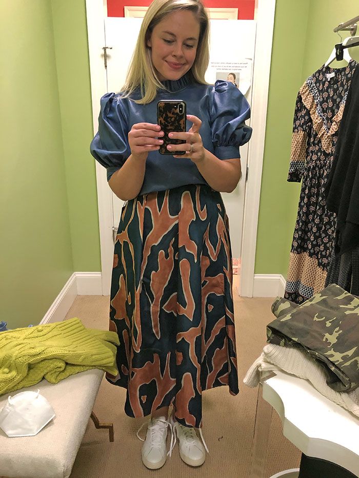 Charlotte's leather top paired with colorful skirt