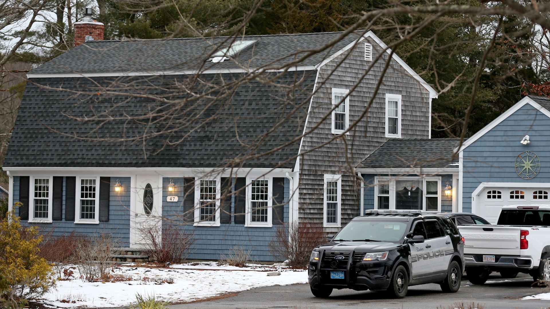 In this January 2023 photo, a police cruiser sits in the driveway at 47 Summer Street, the home of Lindsay Clancy, who strangled her three children and then attempted suicide.

