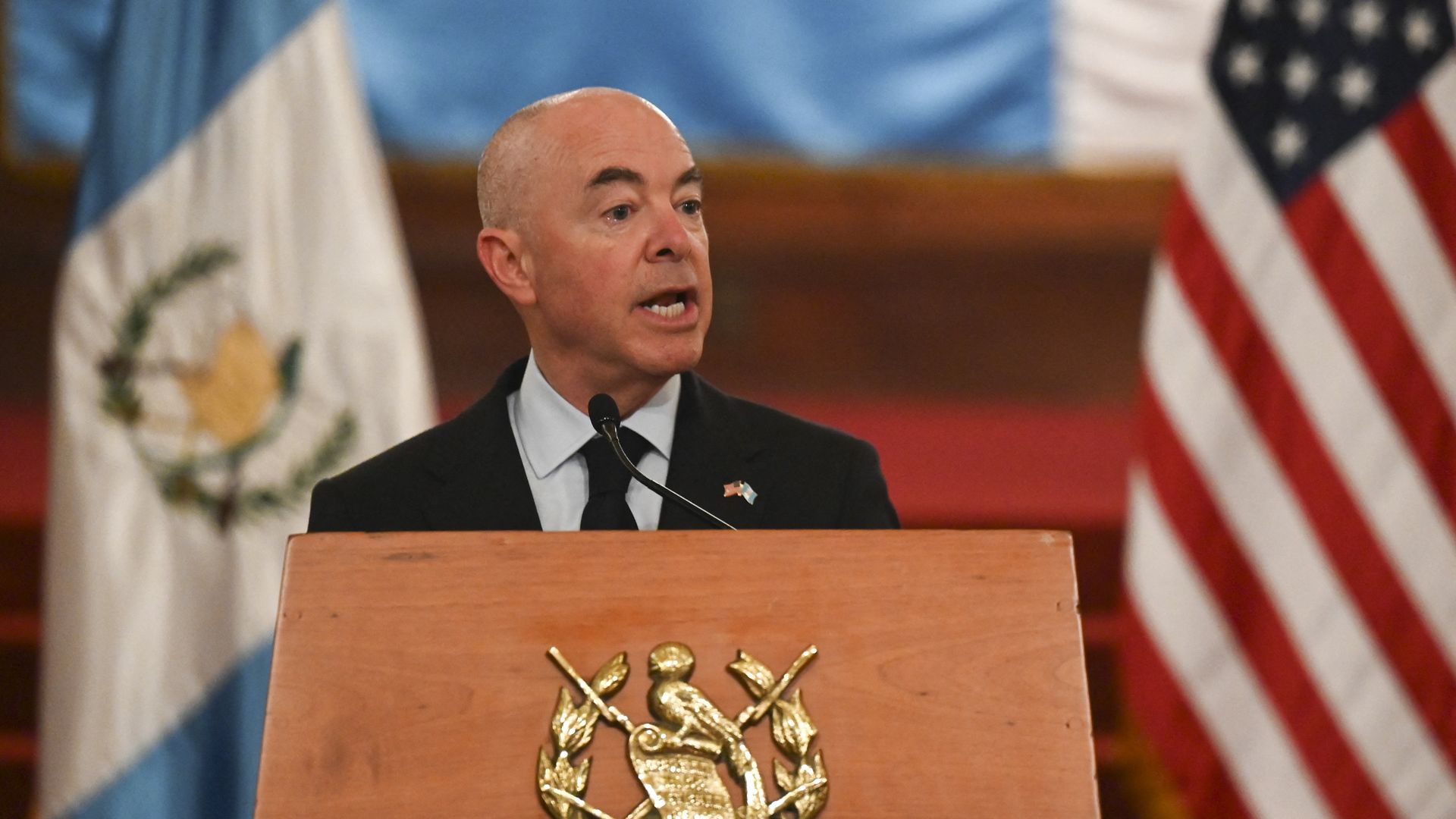 Photo of Alejandro Mayorkas speaking from a podium