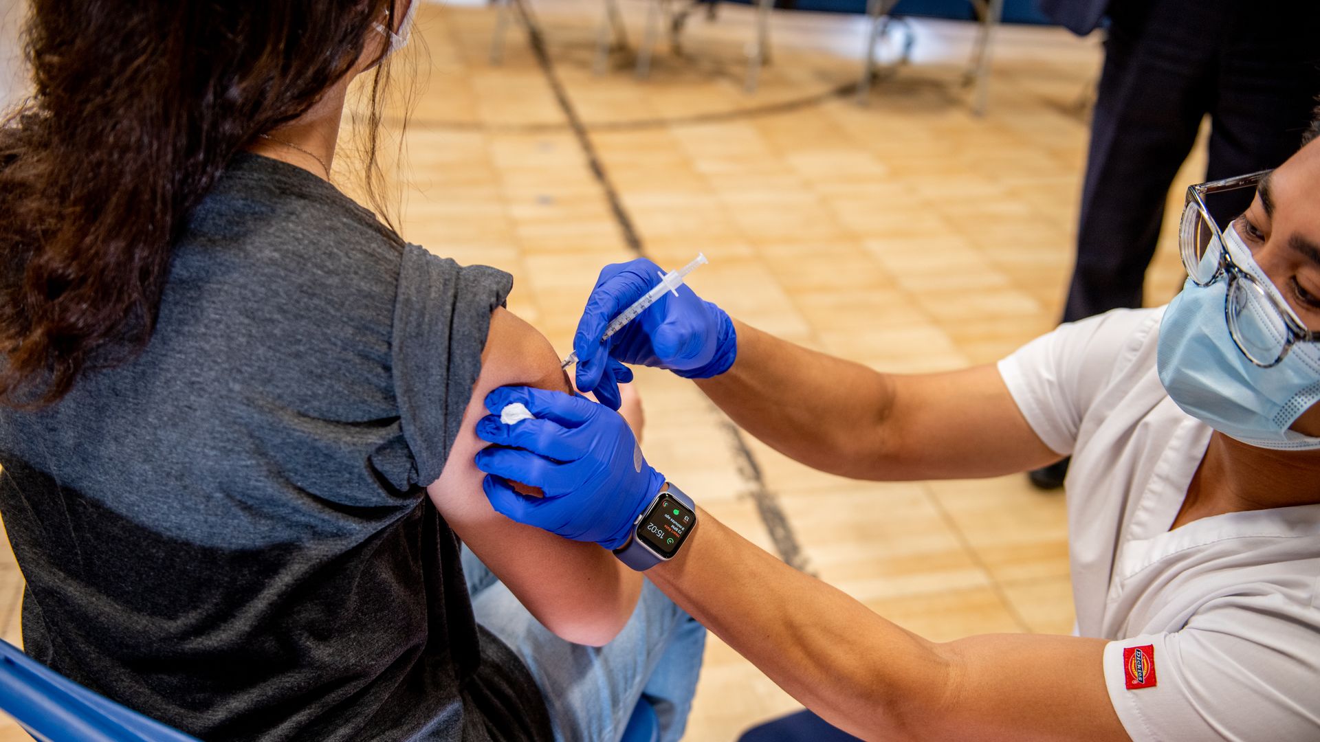 A healthcare worker administers a Covid-19 vaccine to a teenager at a vaccination site at a church in Long Beach, New York, on Thursday, May 13, 2021. 