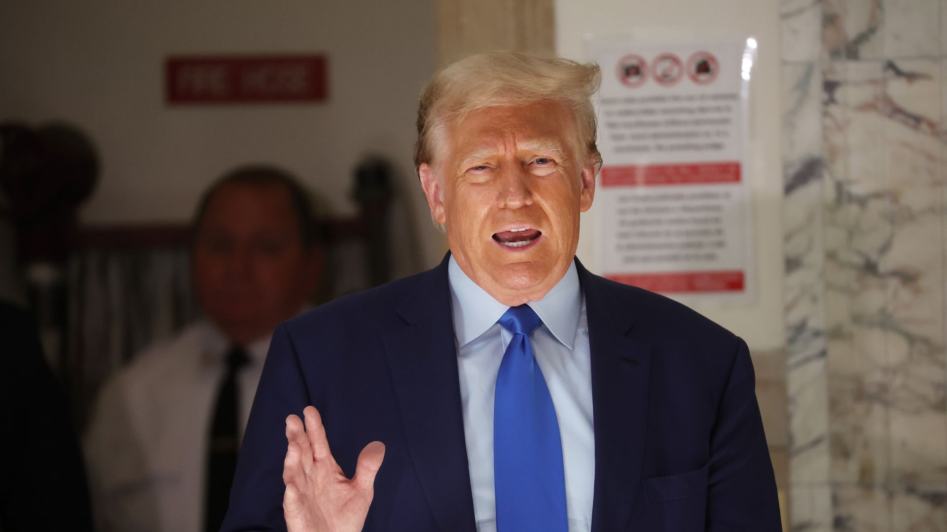 Former President Donald Trump speaks to the media during a break in his civil fraud trial at New York State Supreme Court on October 24, 2023 in New York City.