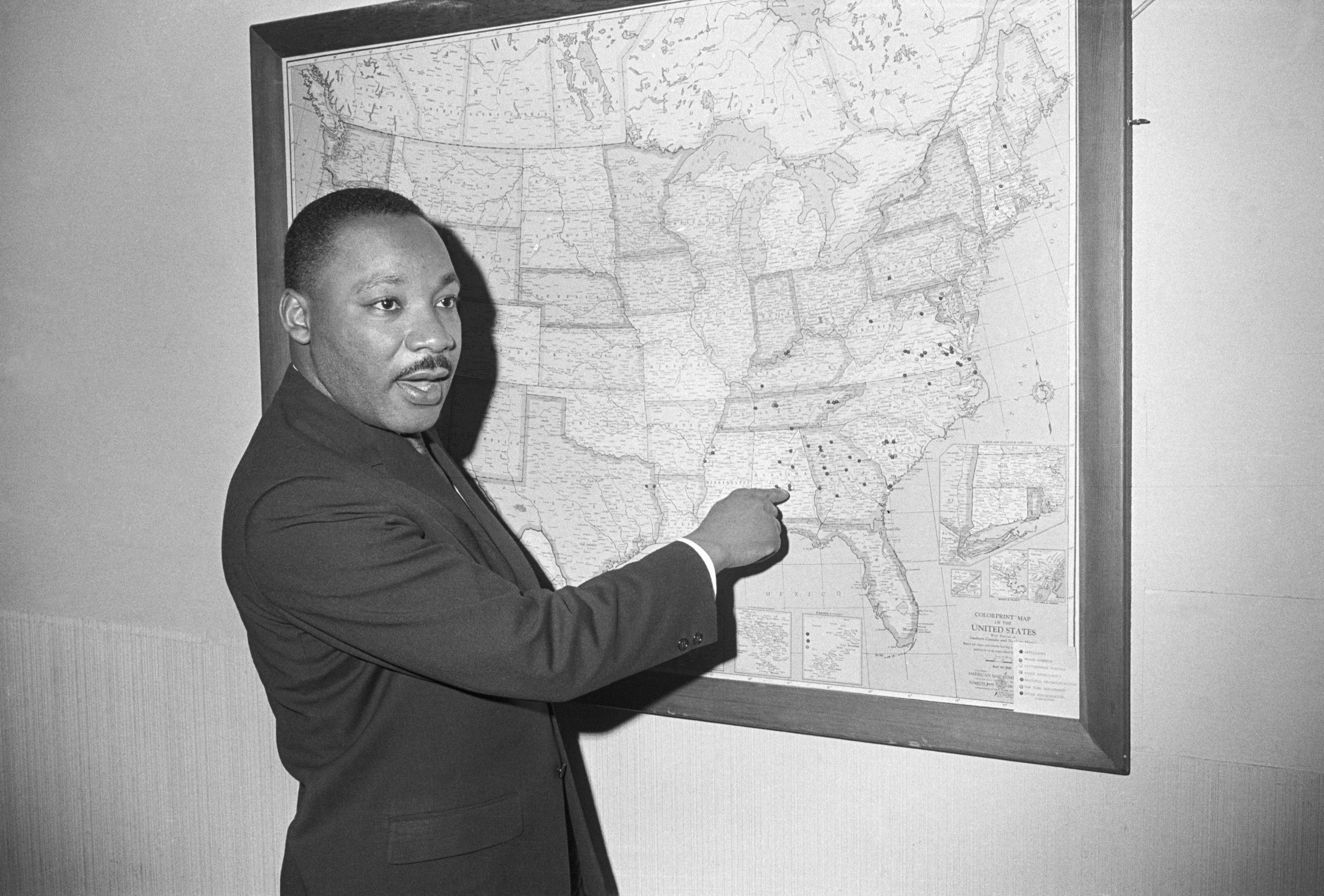 MLK points to a map