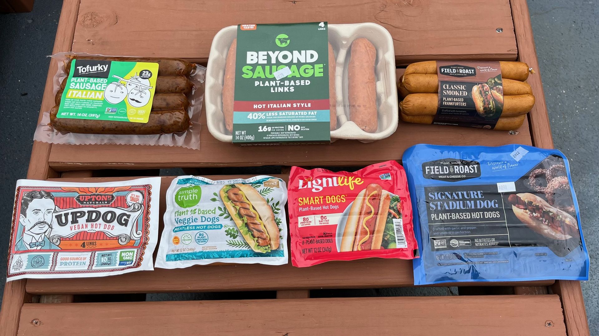 Packages of meat-free hot dogs arranged on a table