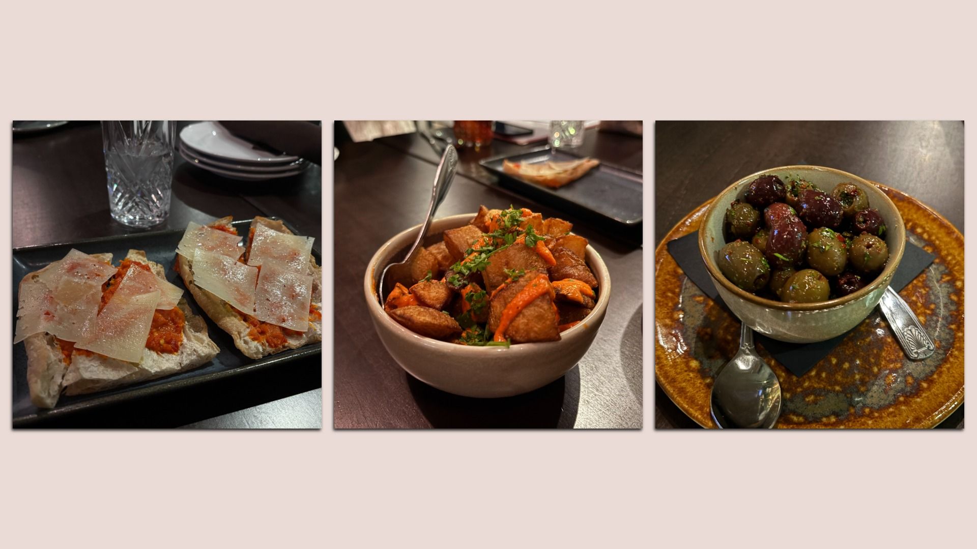 Three dishes: two flatbreads with tomato and thin cheese slices, a bowl of crispy potatoes topped with red sauce and herbs, and a bowl of mixed olives on a brown plate with two spoons.