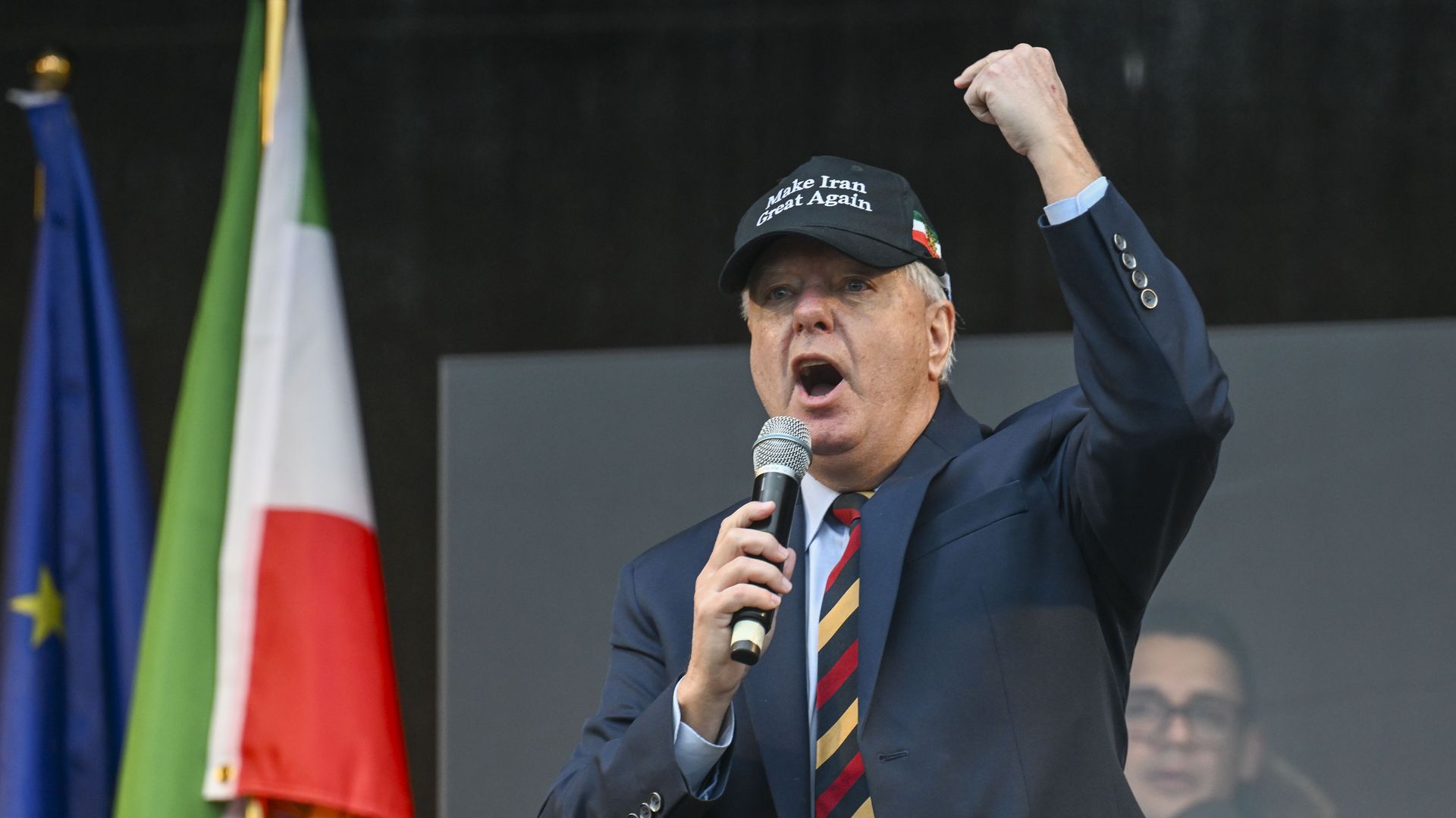 Man in hat pumping fist