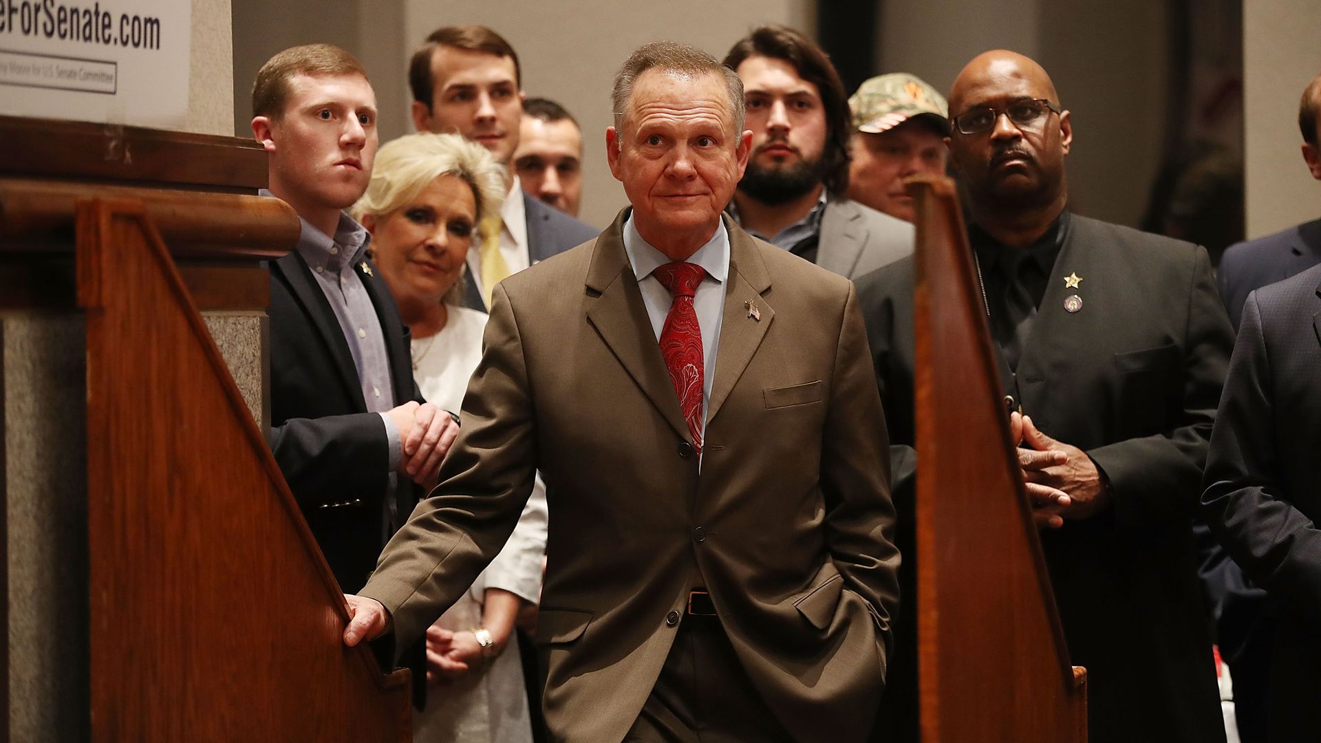 Roy Moore with a group behind him. 