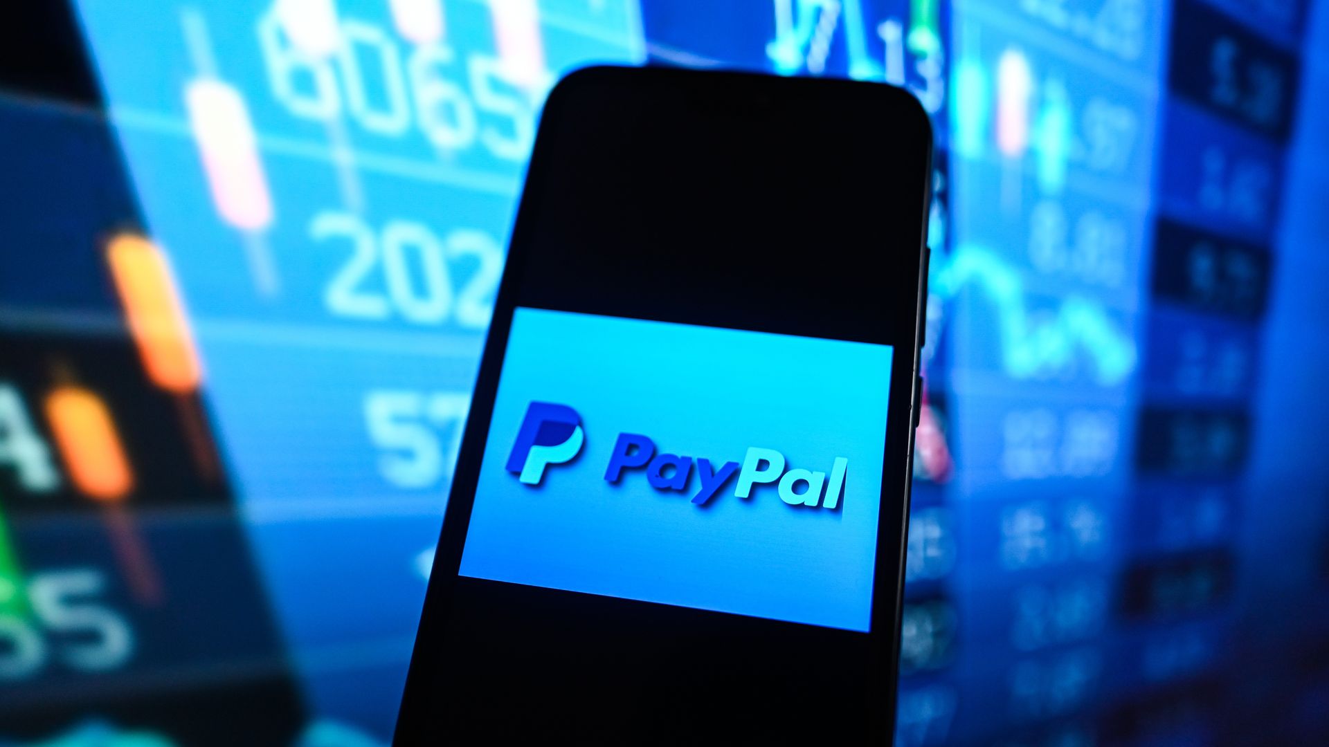 Image of a PayPal logo on a phone screen.