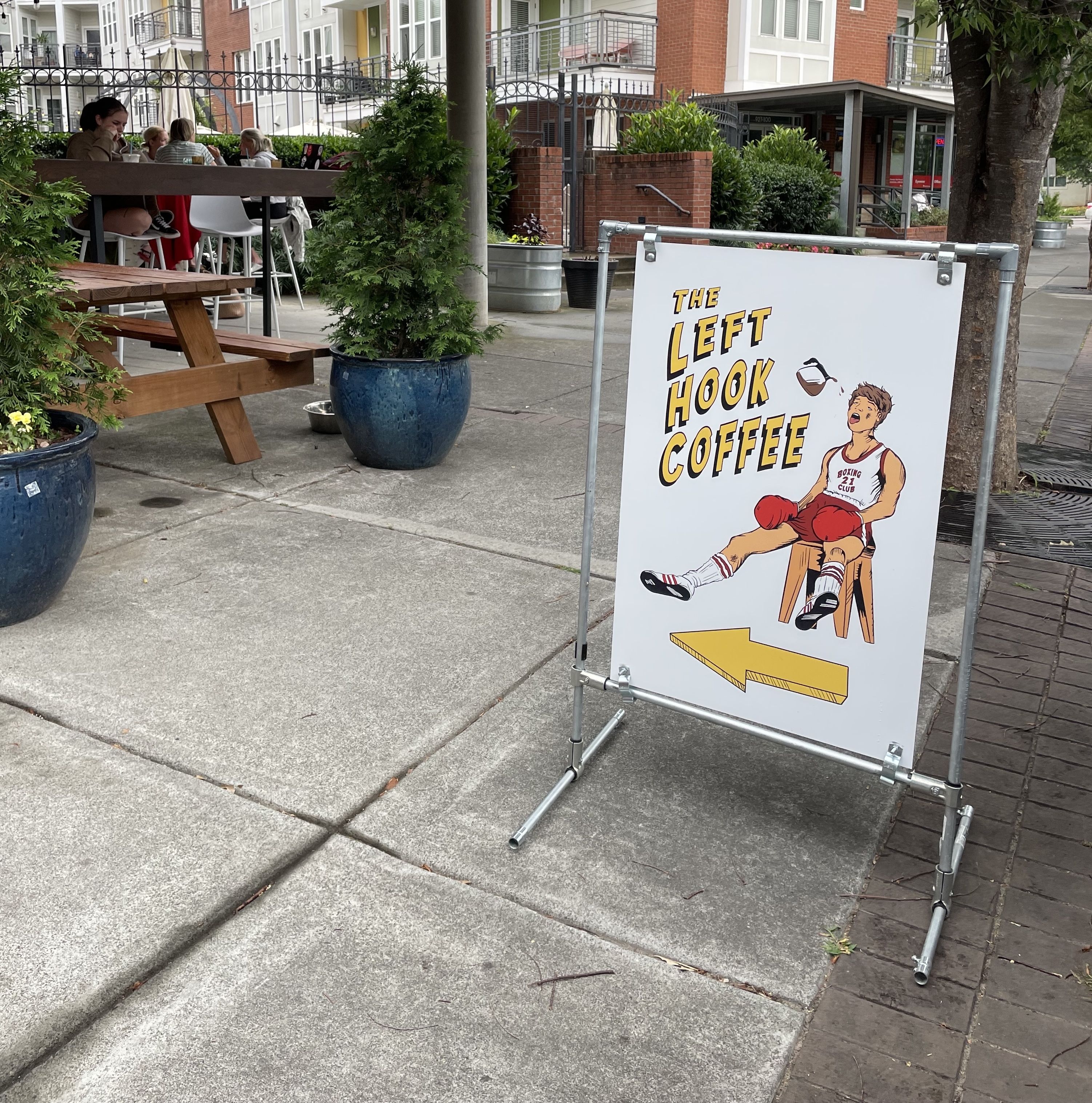 A sign that reads "The Left Hook Coffee"