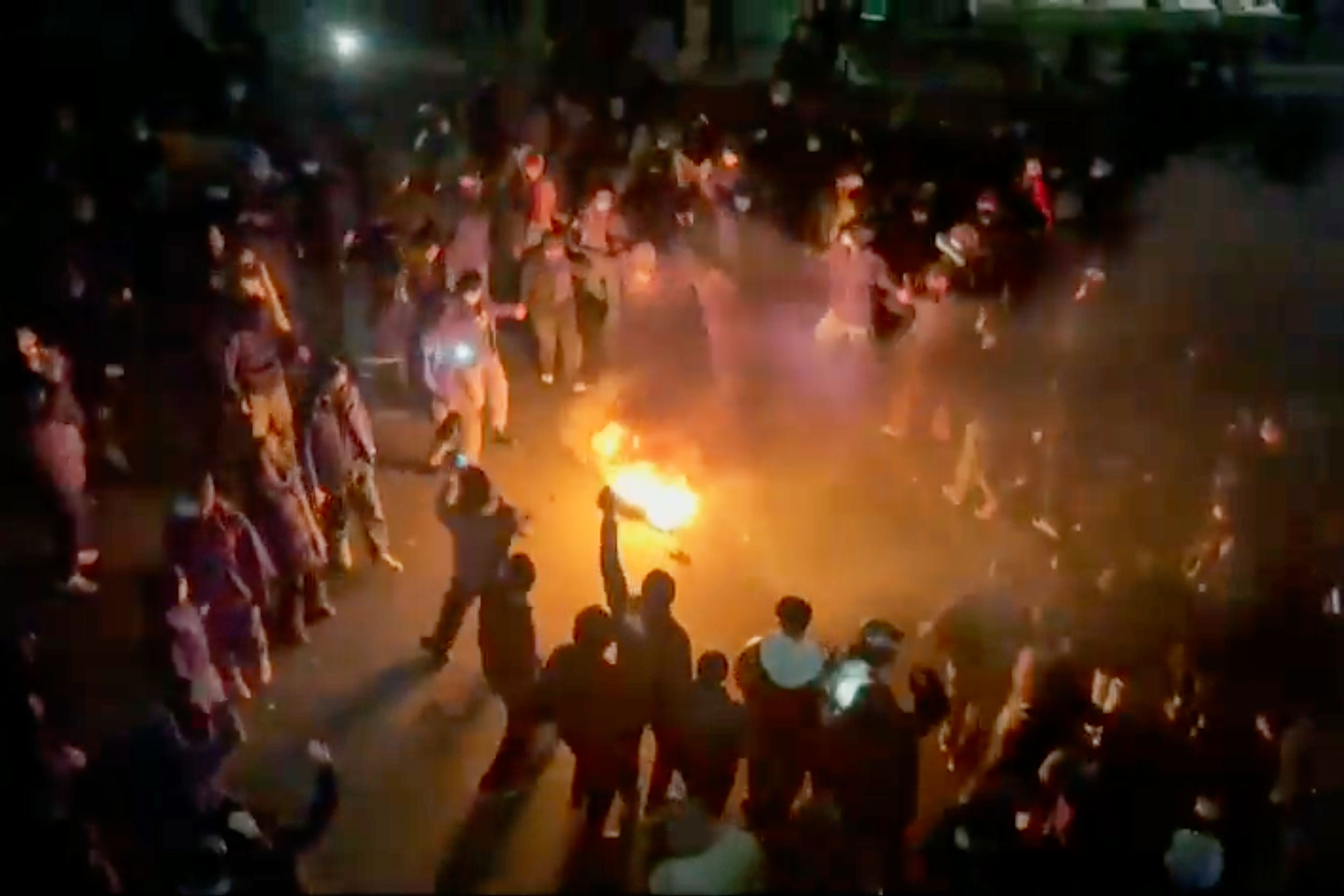 Footage circulating on social media shows protesters dancing and cheering around a bonfire in Tehran. 