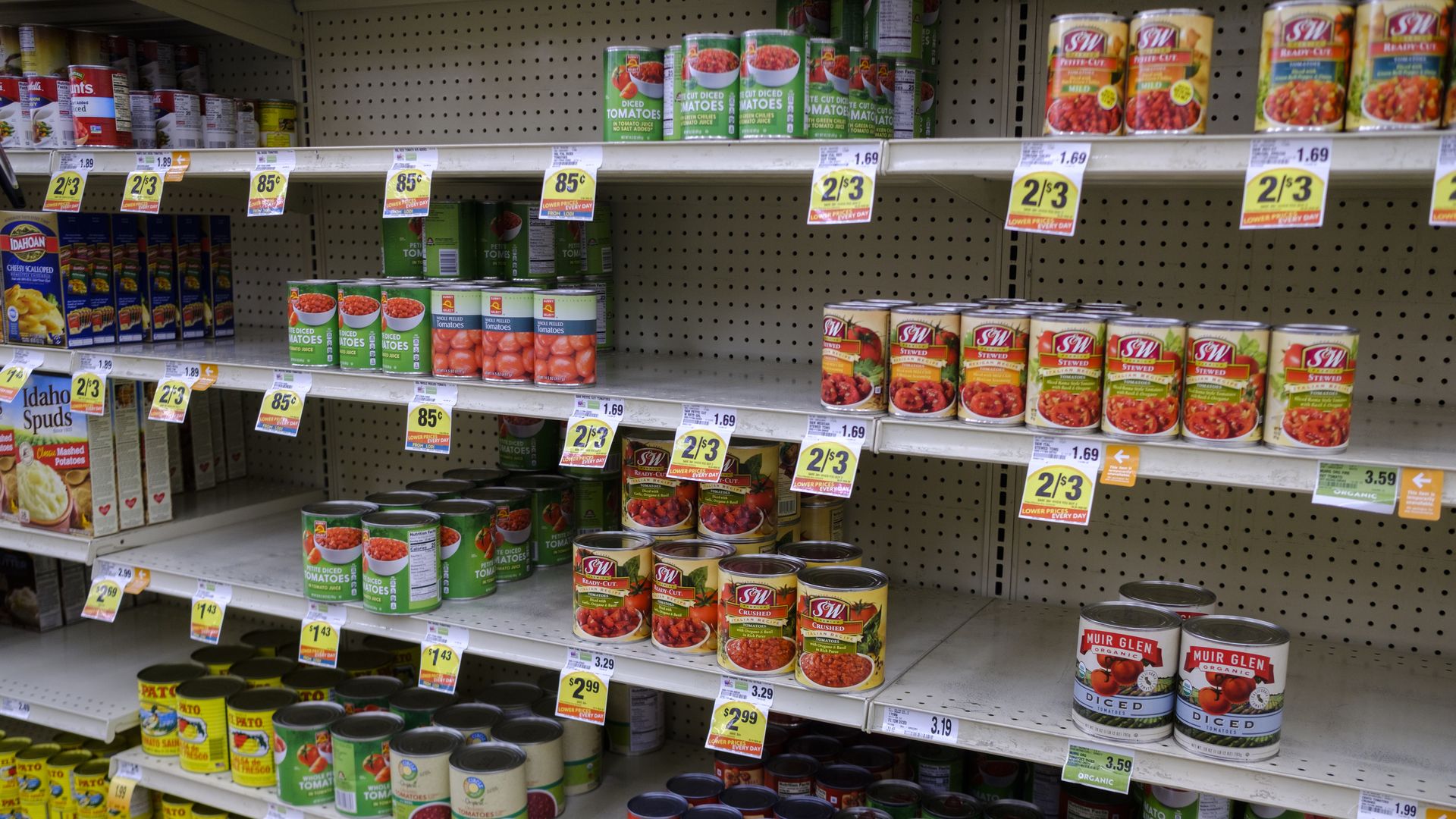 Partially empty supermarket shelves