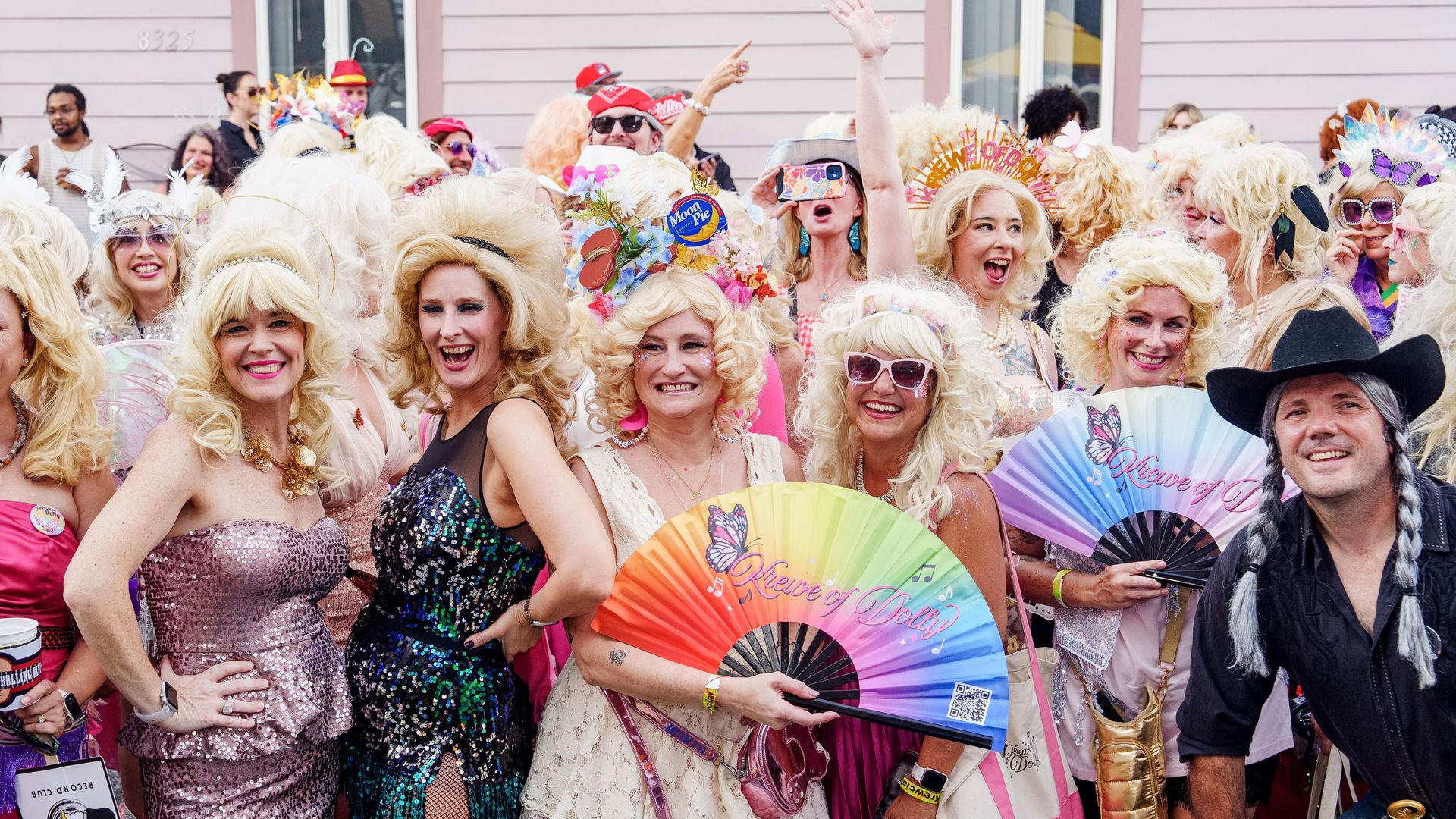 Image shows people dressed as Dolly Parton.